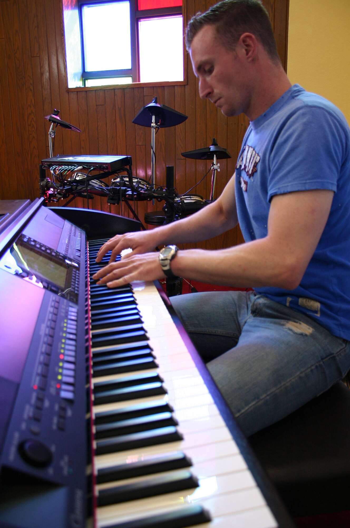 CANNON AIR FORCE BASE, N.M. - Senior Airman Mark Maddon, 27th Special Operations Security Forces Squadron, fine tunes his pianist skills at the Base Chapel Feb. 29. Airman Maddon has been selected to play with the Air Force's Tops in Blue during their 2008 world tour. (U.S. Air Force photo by Airman 1st Class Elliott Sprehe)