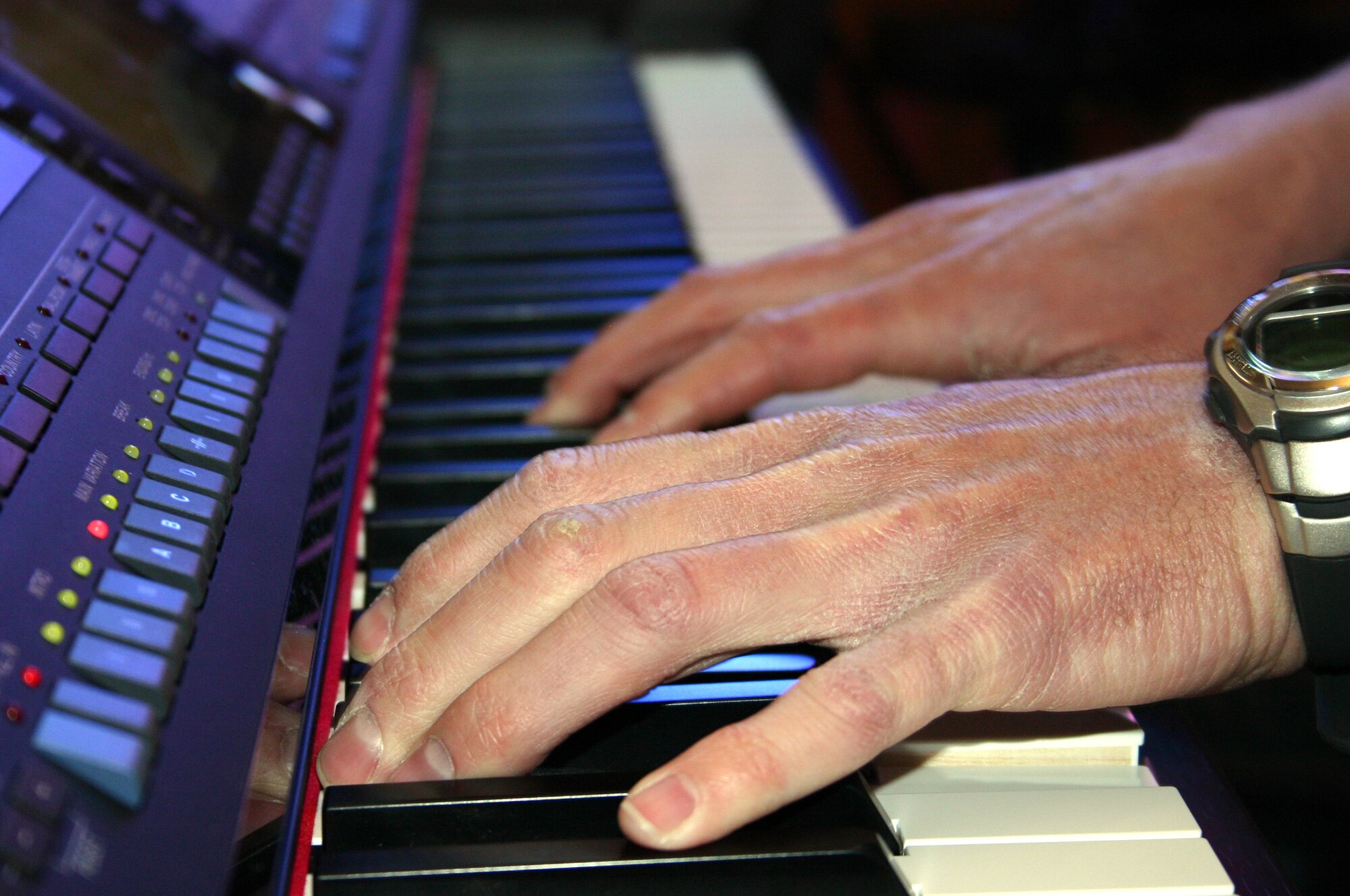 CANNON AIR FORCE BASE, N.M. - The hands of Senior Airman Mark Maddon, 27th Special Operations Security Forces Squadron, strike the keys of a piano at the Base Chapel Feb. 29. Airman Maddon has been selected to perform with the Air Force's Tops in Blue during their 2008 world tour. (U.S. Air Force photo by Airman 1st Class Elliott Sprehe)