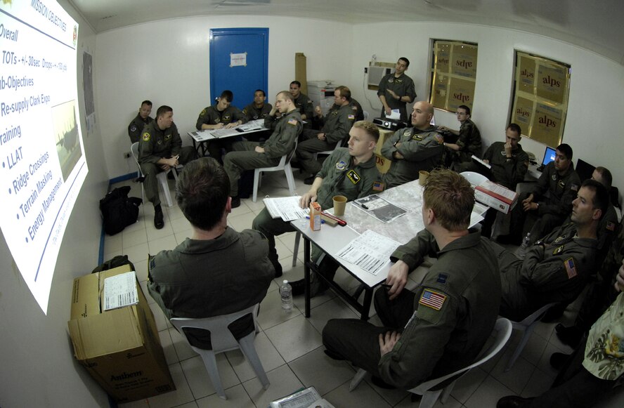 Aircrews conduct a pre-flight briefing at Clark Field, Pampanga, Philippines Feb. 26 during Exercise Balikatan ‘08. The Airmen are from the 36th Airlift Squadron, Yokota Air Base, Japan. Balikatan is an annual combined bilateral exercise involving the U.S. military and the Armed Forces of the Philippines, subject matter experts from the Philippine Civil Defense Agencies and observers from Australia, Indonesia, Malaysia, Brunei, Thailand, and Singapore working on humanitarian and disaster relief efforts. (U.S. Air Force photo/Tech. Sgt. Shane A. Cuomo)