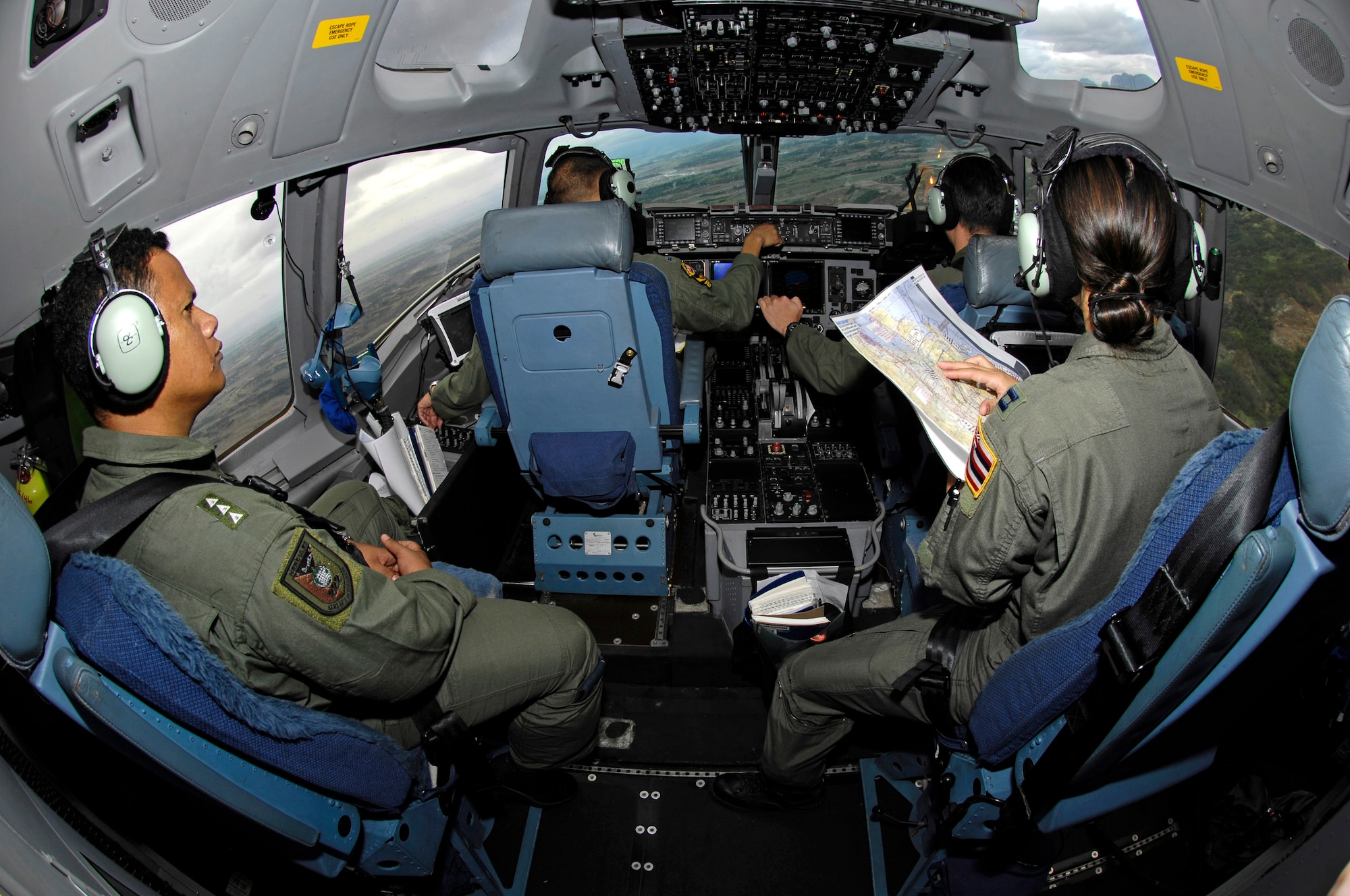 U.S. Air Force pilots, along with a member from the Philippine air force fly a low-level route over the Philippines in a C-17 Globemaster III Feb. 27 during Exercise Balikatan '08. The U.S. pilots are from the Hawaii Air National Guard's 204th Airlift Squadron. Balikatan is an annual joint and bilateral exercise working on humanitarian and disaster relief training. (U.S. Air Force photo/Tech. Sgt. Shane A. Cuomo) 