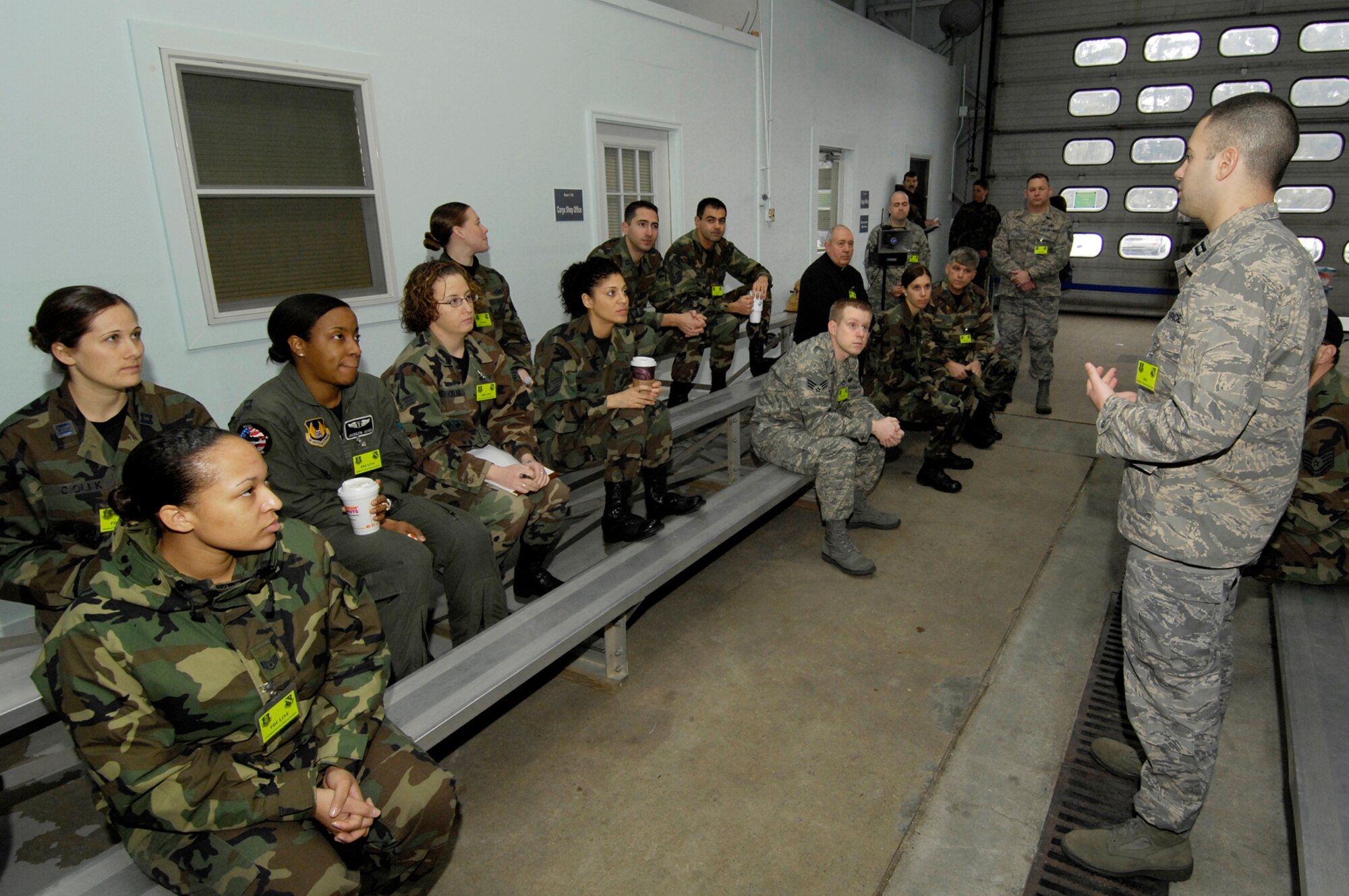 HANSCOM AFB, Mass. -- Capt. Chris Ruscio, 66th Mission Support Squadron, briefs Hanscom servicemembers before they process base personnel through the Personnel Deployment Function line during the Base Readiness Exercise Feb. 27. Eighty-six personnel were tasked for the BRE, 64 of which were physically processed through the PDF line. The BRE was an Initial Response Exercise evaluating the base’s ability to respond to a short-notice Joint Chiefs of Staff contingency deployment scenario. This was the first Initial Response Exercise since the Operational Readiness Inspection in June 2007. (U.S. Air Force photo by Mark Wyatt.)