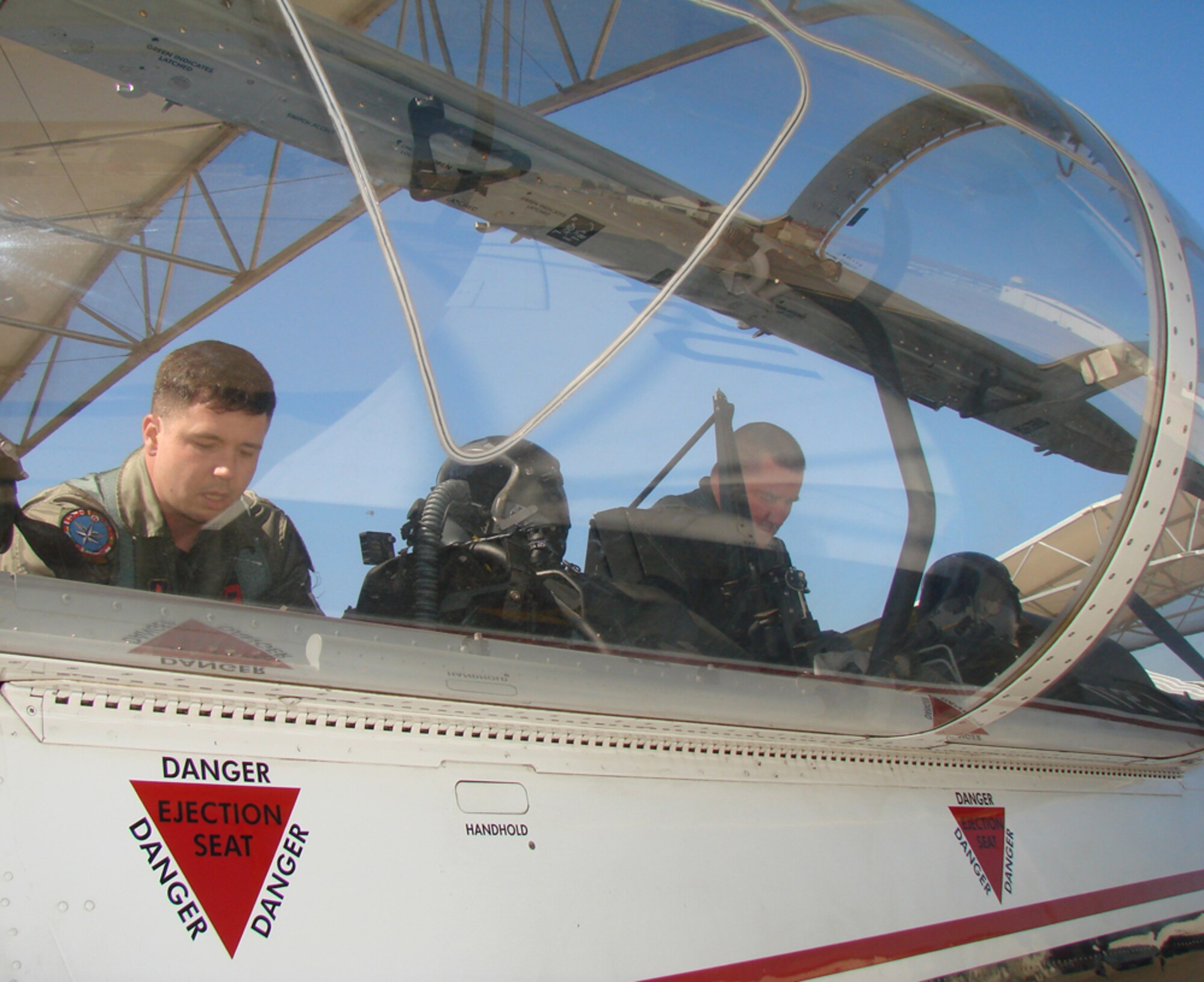 Maj. Stephen Rau, (right), 8th Flying Training Squadron instructor pilot at Vance Air Force Base and Maj. Steven Lygren, (left) instructor pilot with the 89th Flying Training Squadron at Sheppard AFB, Texas,  pair up to assist with the transition from T-37 Tweet to T-6A Texan Phase II undergraduate pilot training at Sheppard. For two weeks, a total of eight instructor pilots from Sheppard and 12 from Vance worked to accomplish mission qualification training flights, advanced handling characteristics training and T-6 runway supervisory unit qualification training. (U.S. Air Force photo by 2nd Lt. Agneta Murnan)