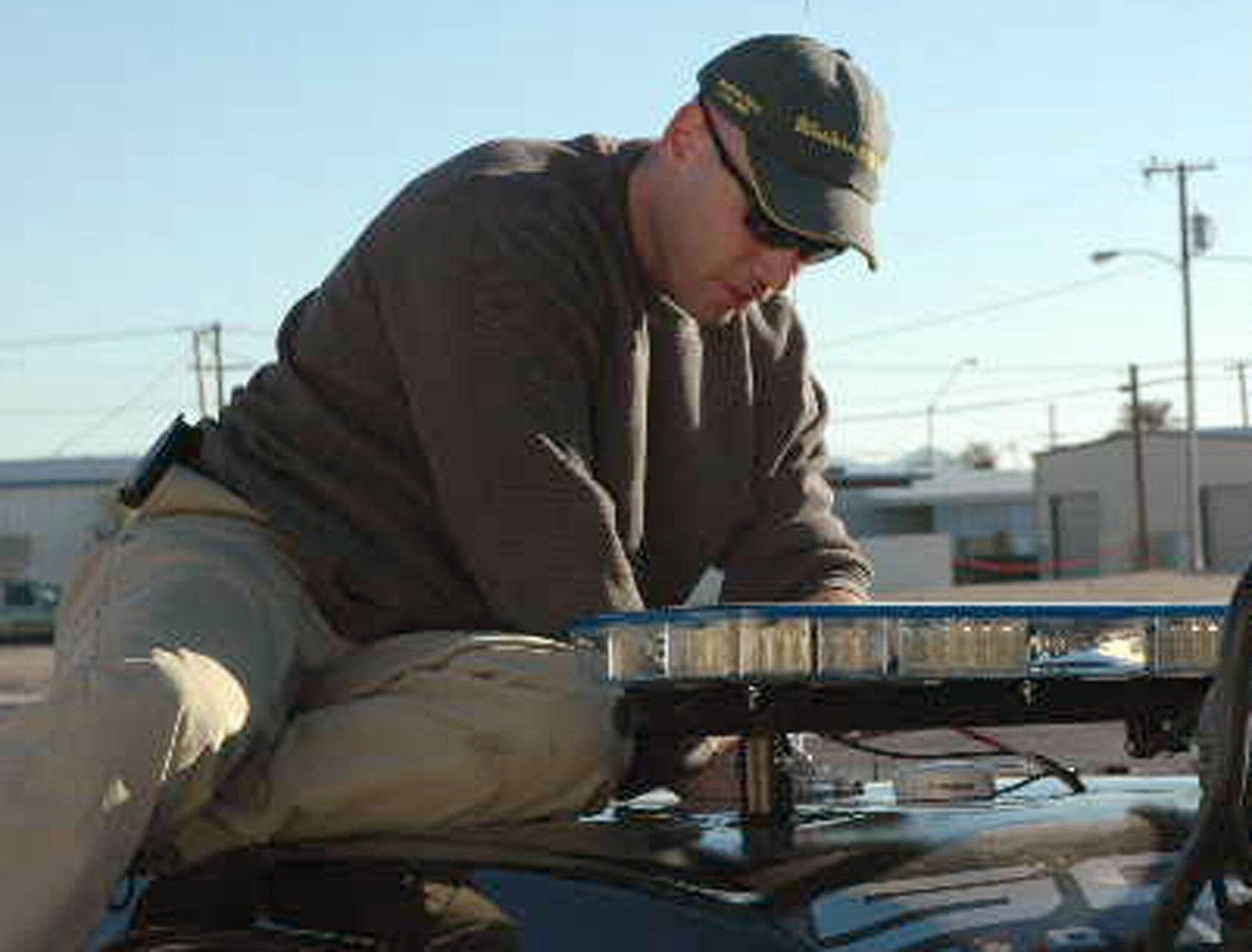 Maj. Steven Heffington, 95th Security Forces Squadron commander, fixes the Los Angeles County Sheriffs Department Motorsports team's truck during the Best of the Desert Racing Association's Blue Water Resort Parker 425 competition in Arizona. Major Heffington volunteers on the sheriff's team as an off-road racer. (Courtesy photo) 