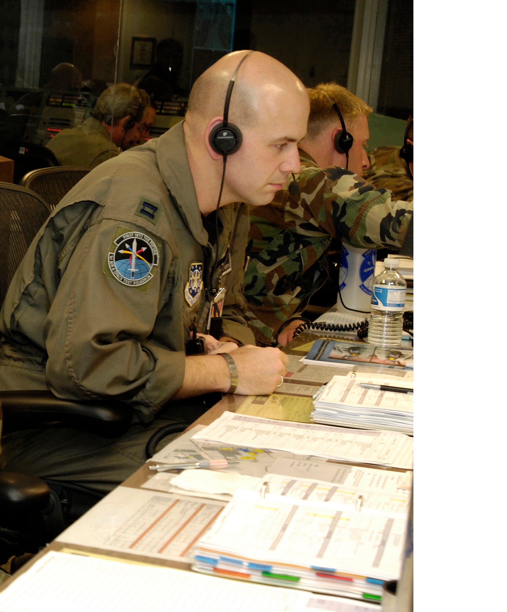 VANDENBERG AIR FORCE BASE, Calif. -- Capt. Joseph Fortin, 1st Air and Space Test Squadron training section chief, operates a console and performs a pre-launch checklist during the FTG-03 launch attempt on May 25, 2007.  Members of the 1st ASTS follow along in the countdown checklist as the launch conductor reads the count over the net.( U.S Air Force Photo )


