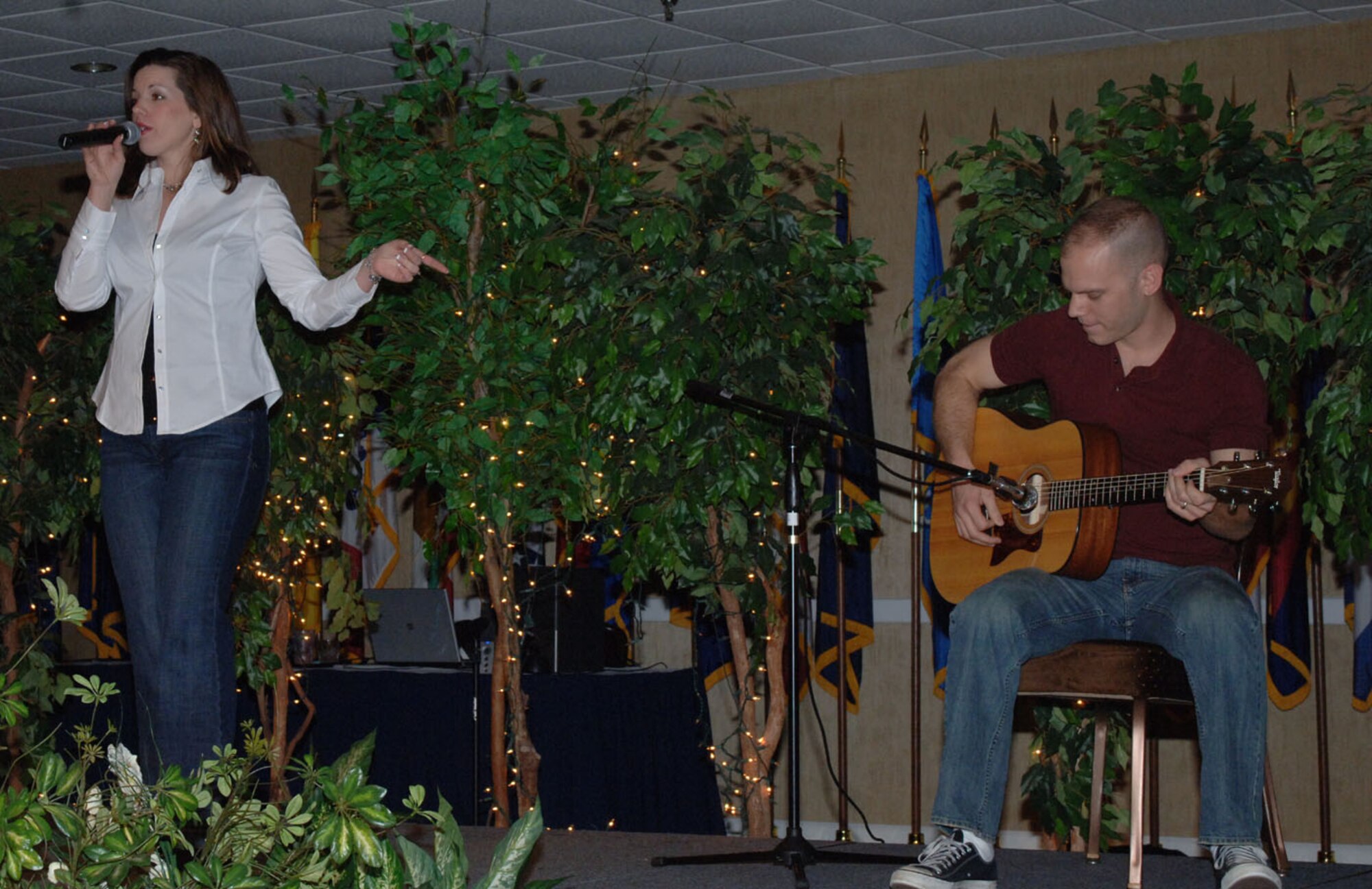 Marie McMenamy, recruited the help of her husband, 2nd Lt. Chris McMenamy, SUPT class 08-09, to play the guitar while she sang “Black Horse and Cherry Tree” by KT Tunstall at the "Columbus Idol" Friday night. The BLAZE 56 Council hosted the event, which featured seven contestants. The competition was similar to the popular "American Idol" competition. (U.S. Air Force photo by Airman 1st Class Danielle Hill)