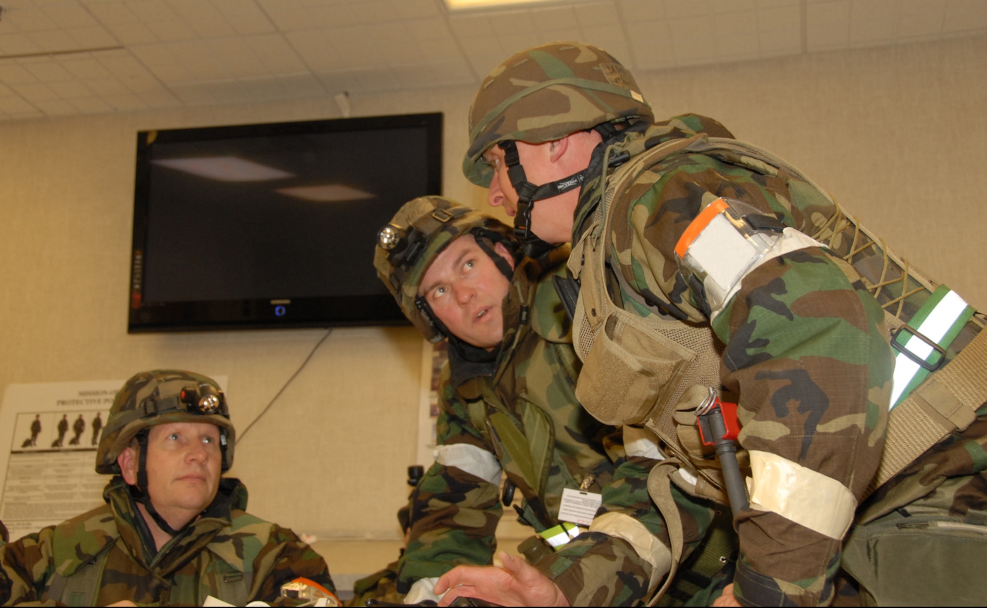 Personnel in the Emergency Operations Center discuss their next step at the Operational Readiness Inspection in January at Gulfport, Miss. The 151st Air Refueling Wing recieved a “Satisfactory” grade from the Inspector General at the Feb. 14 outbrief.