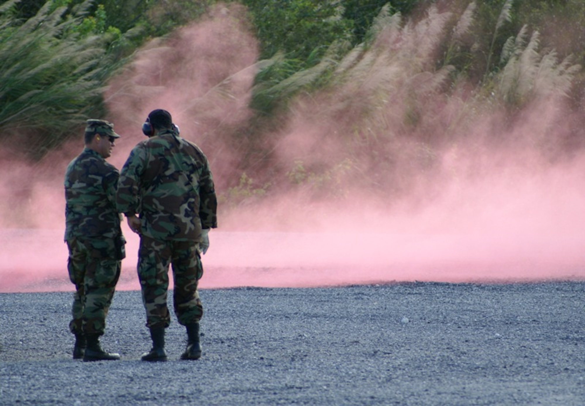 Master Sgt. James Raulerson, 482nd Civil Engineer Squadron’s Explosive Ordnance Disposal Flight technician (left), instructs Senior Master Sgt. Eddie Hodgson (right), 482nd Security Forces Squadron, on how to use smoke grenades and ground burst simulators on March 3. The instruction is in preparation for the upcoming base-wide Operational Readiness Exercise set for March 8-11. The simulators will create blasting noises and smoke for the realistic scenarios that reservists will encounter during the exercise. “Homestead Air Reserve Base goes to great lengths to ensure safety procedures are established and followed during exercises to prepare our reservists for deployment,” said Mr. Sean Quinn, 482nd Mission Support Group Emergency Management Office. (U.S. Air Force photo/Senior Airman Erik Hofmeyer)