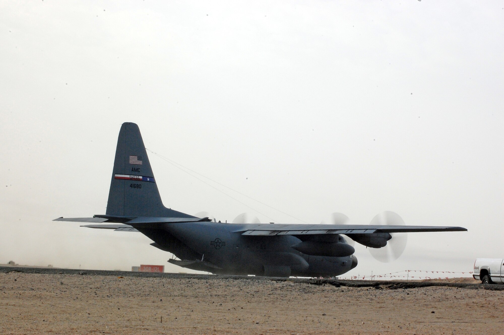 SOUTWEST ASIA -- A C-130 Hercules assigned to the 386th Air Expeditionary Wing taxis into position for take-off from a Southwest Asia air base recently. The mission is part of leaflet air drop mission supporting the Australians from Overwatch Battle Group [West]-4 in southern Iraq. (U.S. Air Force photo/Tech. Sgt. Michael O’Connor)
