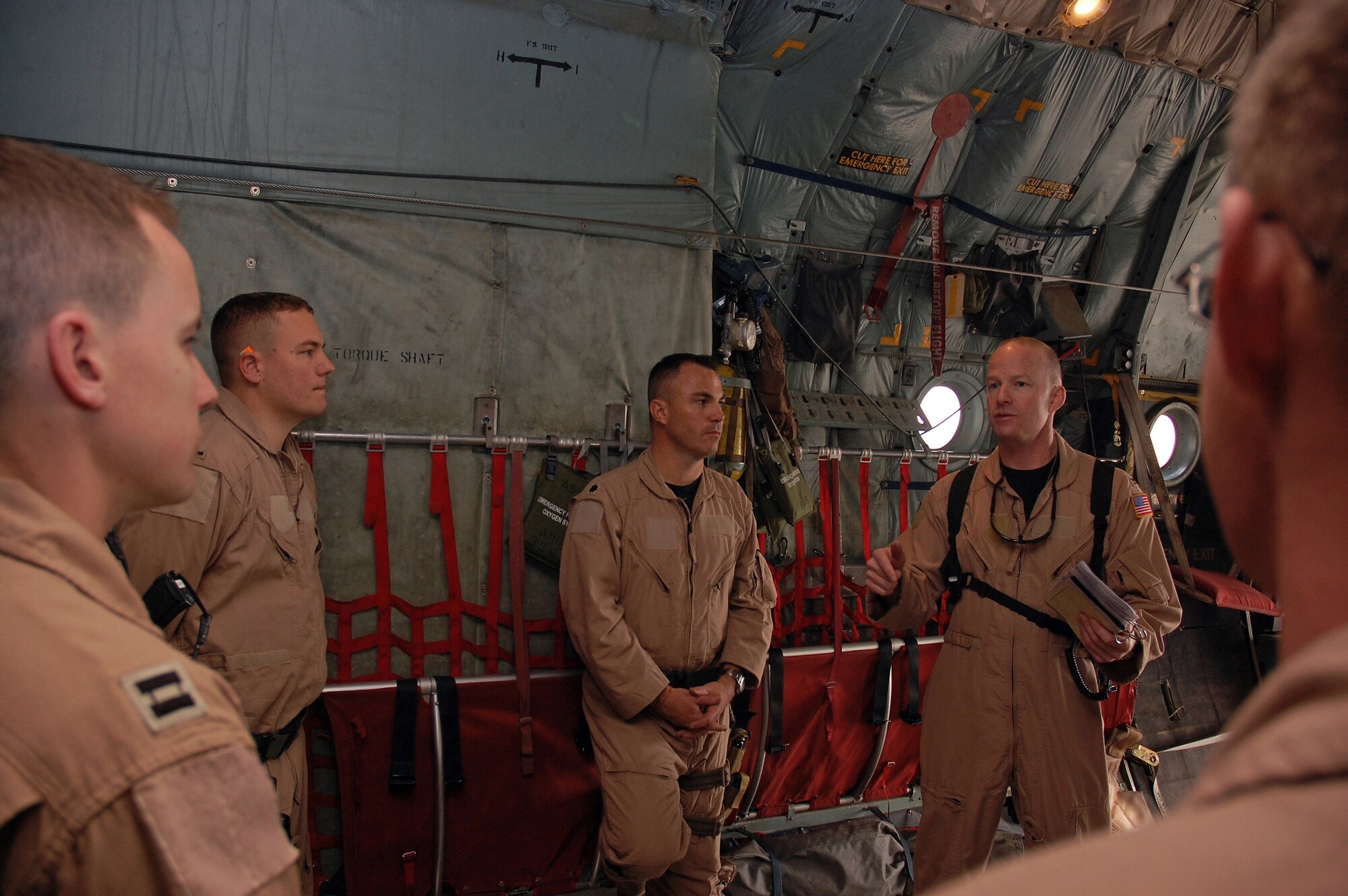 SOUTHWEST ASIA -- Colonel Gary Goldstone, 386th Expeditionary Operations Group commander goes over safety procedures related to a leaflet air drop mission prior to take-off from a Southwest Asia air base recently. The mission is part of leaflet air drop mission supporting the Australians from Overwatch Battle Group [West]-4 in southern Iraq. (U.S. Air Force photo/Tech. Sgt. Michael O’Connor)