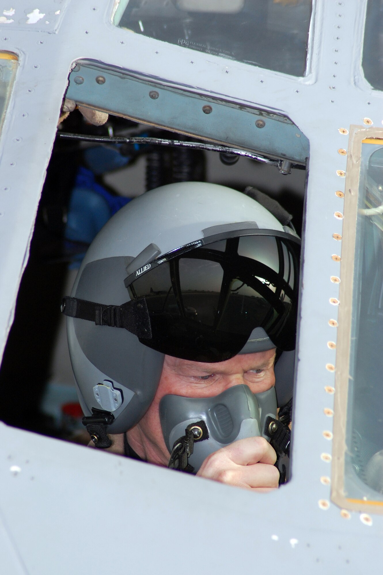 SOUTHWEST ASIA -- Colonel Gary Goldstone, 386th Expeditionary Operations Group commander tests his oxygen mask during the preflight of a C-130 Hercules at a Southwest Asia air base recently. The mission is part of leaflet air drop mission supporting the Australians from Overwatch Battle Group [West]-4 in southern Iraq. Colonel Goldstone is deployed from Littlerock Air Force Base, Ark. (U.S. Air Force photo/Tech. Sgt. Michael O’Connor)