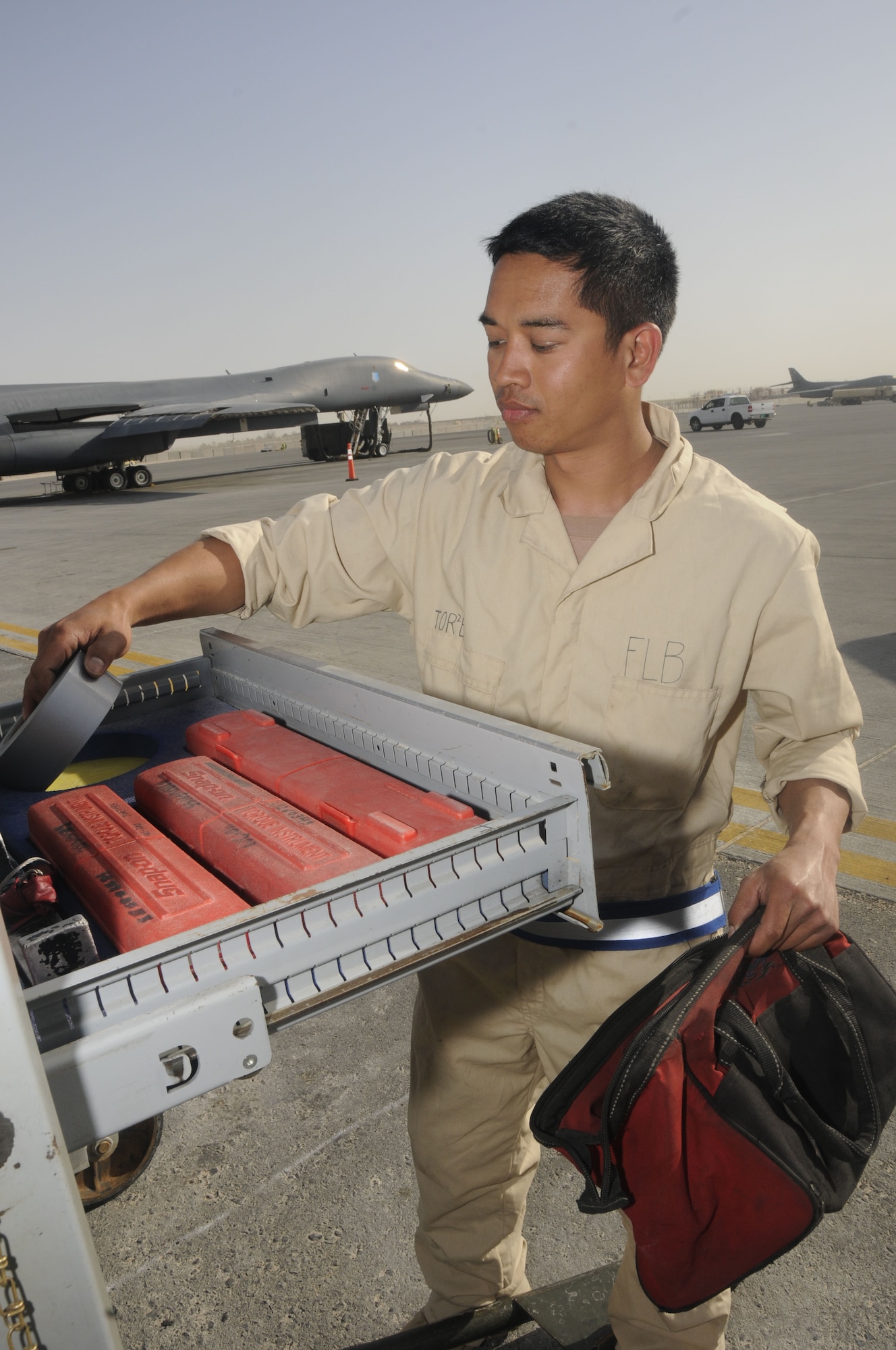 Airman 1st Class Timothy Torres, 37th Aircraft Maintenance Unit, replaces tools Feb. 27.  Airman Torres is a part of a four-man load crew team for the B-1 Lancer, deployed here from Ellsworth Air Force Base, S.D. (U.S. Air Force photo/Senior Airman Domonique Simmons)