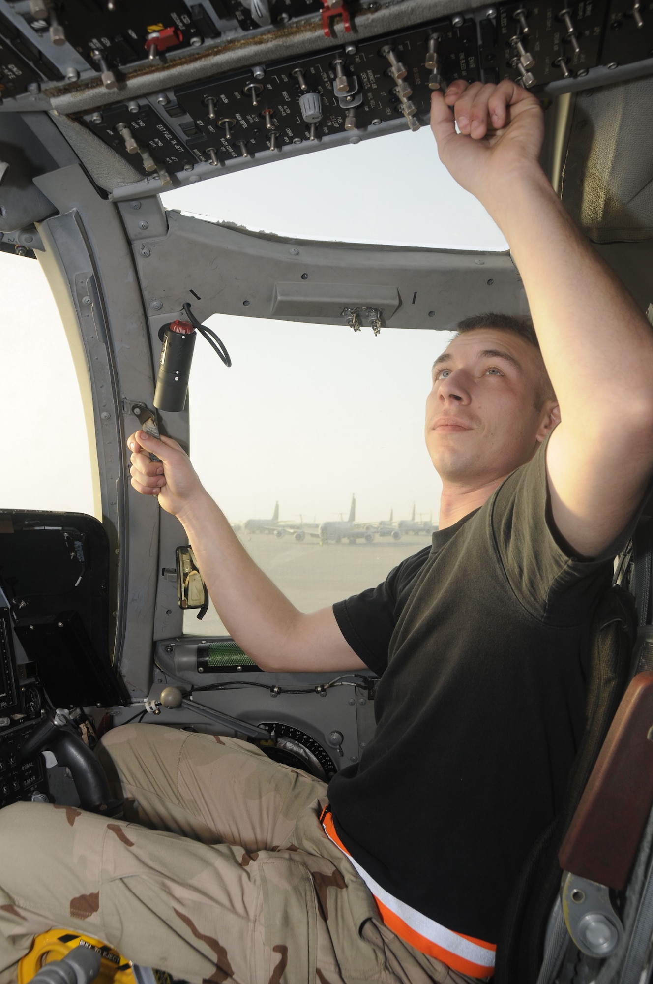 Senior Airman David Spata, from the 37th Aircraft Maintenance Unit technical order distribution office, performs function checks in the cockpit of a B-1 deployed from Ellsworth Air Force Base, S.D., Feb 27. (U.S. Air Force photo/ Senior Airman Domonique Simmons)
