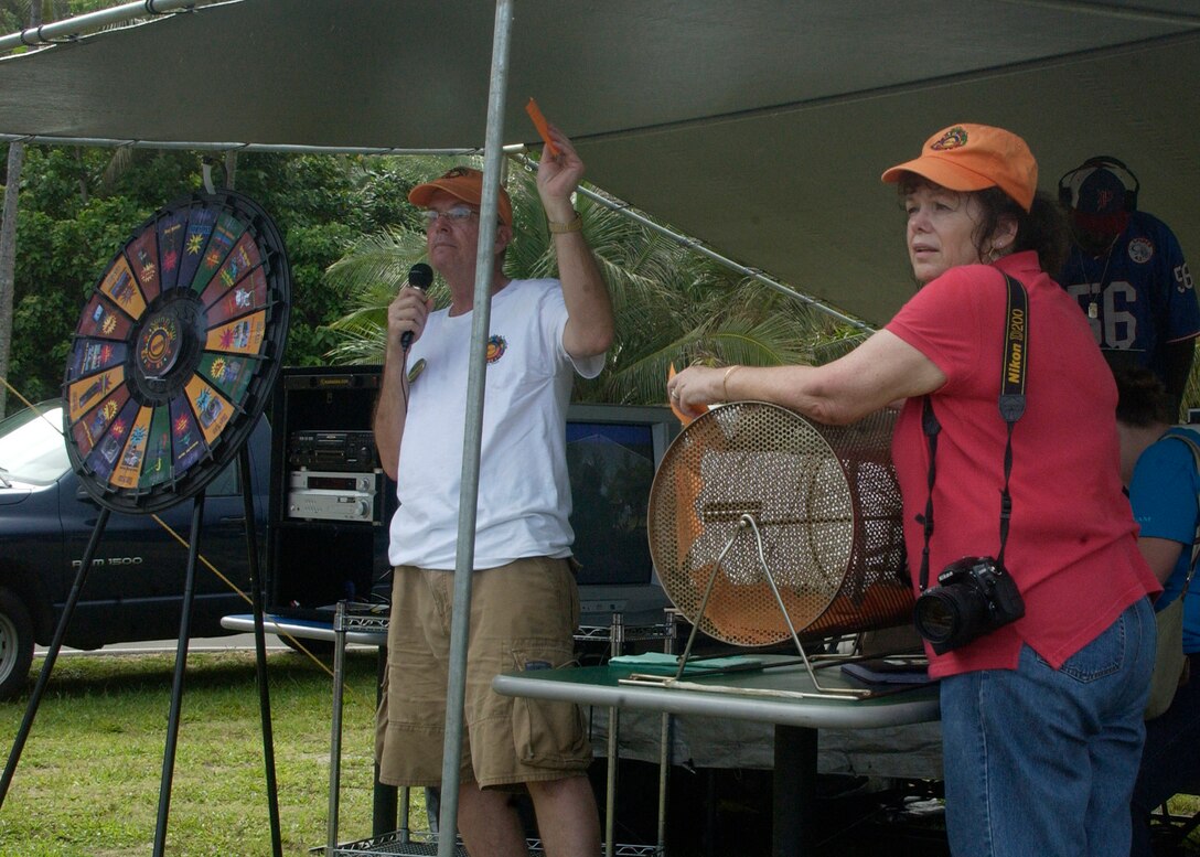 ANDERSEN AFB, Guam - Ralph Ridgeway announces a prize winner during during the customer appreciation picnic. (U.S. Air force photo by Airman 1st Class Zachary Hunter)