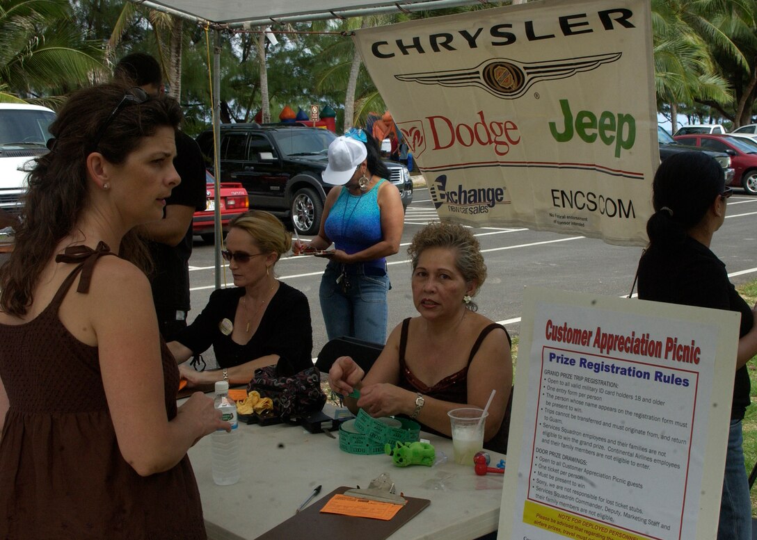 ANDERSEN AFB, Guam - A Team Andersen member registers for a prize during the 36th Services Squadron's customer appreciation picnic Feb. 29 at Tarague Beach. Chrysler was one of the sponsors of the picnic. (U.S. Air force photo by Airman 1st Class Zachary Hunter)