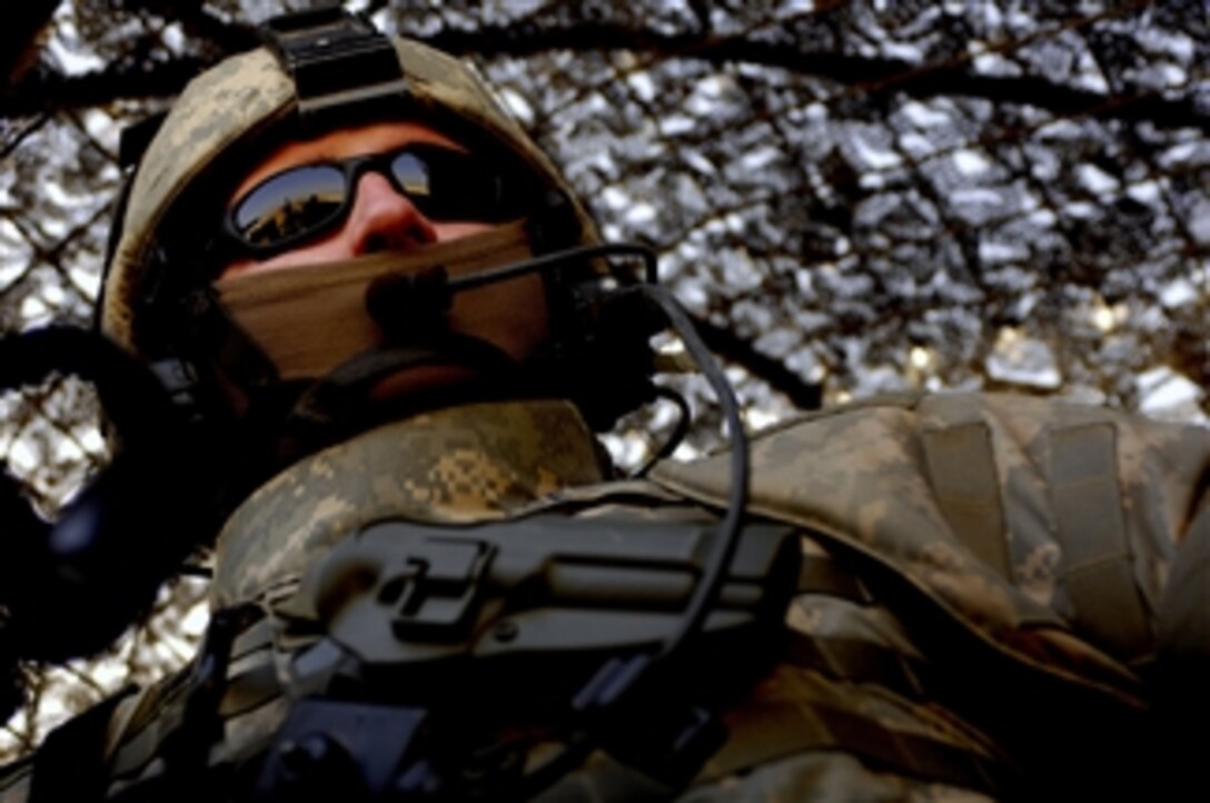 U.S. Air Force Senior Airman Eugene Naece scans his area of fire during a patrol in Baghdad, Iraq, on March 3, 2008.  Naece is assigned to the Air Force's 732nd Expeditionary Security Forces Squadron.  