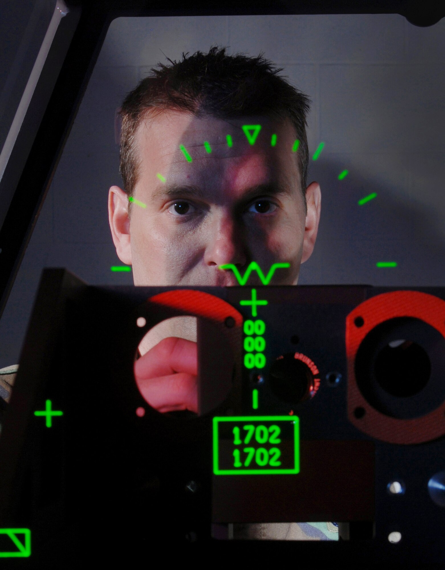 Technical Sgt. James Erickson, an avionics integrated technician assigned to the 452nd Maintenance Squadron, March Air Reserve Base, Calif., checks the bore sight values of a C-17 Globemaster III cargo aircraft Head-Up Display (HUD) unit being tested on a Display Unit Test Set (DUTS).  Avionics technicians install, maintain and repair electronic and electrical systems on all types of aircraft and they also maintain a high degree of readiness to deploy worldwide to support wartime and contingency operations and operations other than war in support of national interests and objectives. (U.S. Air Force photo by Val Gempis)