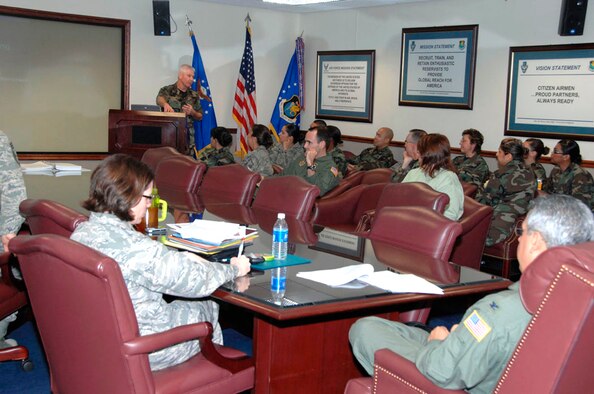 TRAVIS AIR FORCE BASE, Calif. -- May I have your attention: Senior Master Sgt. Steven Beck, the new Chief of Education and Training for the 349th Air Mobility Wing, Travis Air Force Base, Calif., helps pass some time by presenting three ancillary training courses to wing staff members who were required to “shelter-in-place” at the wing command conference room during a base exercise March 5. Sheltering-in-place is part of a base wide exercise that evaluates the wing's ability to execute the Comprehensive Emergency Management Plan in response to a terrorist's use of weapons of mass destruction. This has been a busy week for the 349th because it is also being evaluated by a visiting I.G. Unit Compliance Inspection team. (U.S. Air Force photo/Master Sgt. Wendy Weidenhamer)  