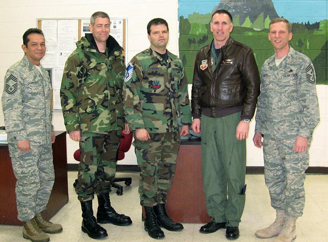 (Left to right) Chief Master Sgt. Kenneth Charfauros, 28th Maintenance Group superintendent; Col. Thomas Fitch, 28th Maintenance Group commander; Master Sgt. Anthony Brown, 28th Maintenance Squadron aircraft hydraulic systems craftsman; Col. Scott Vander Hamm, 28th Bomb Wing commander and Chief Master Sgt. John Gillette, 28th Bomb Wing command chief master sergeant; pose for a picture after tacking on Sergeant Brown's new stripes. Sergeant Brown was promoted to the rank of master sergeant through the Stripes for Exceptional Performers program, March 5. Sergeant Brown greatly exceeded the standards as a technical sergeant, earning the immediate promotion, which is given out to only a few Airmen nominated for the highly selective STEP program throughout the wing.
