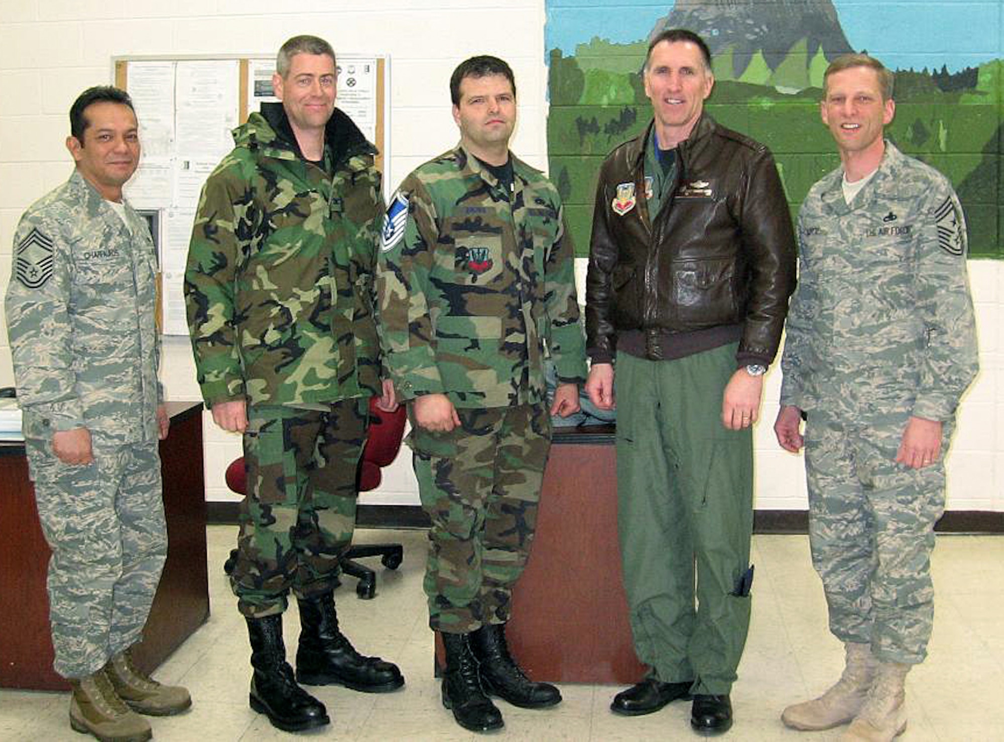 (Left to right) Chief Master Sgt. Kenneth Charfauros, 28th Maintenance Group superintendent; Col. Thomas Fitch, 28th Maintenance Group commander; Master Sgt. Anthony Brown, 28th Maintenance Squadron aircraft hydraulic systems craftsman; Col. Scott Vander Hamm, 28th Bomb Wing commander and Chief Master Sgt. John Gillette, 28th Bomb Wing command chief master sergeant; pose for a picture after tacking on Sergeant Brown's new stripes. Sergeant Brown was promoted to the rank of master sergeant through the Stripes for Exceptional Performers program, March 5. Sergeant Brown greatly exceeded the standards as a technical sergeant, earning the immediate promotion, which is given out to only a few Airmen nominated for the highly selective STEP program throughout the wing.