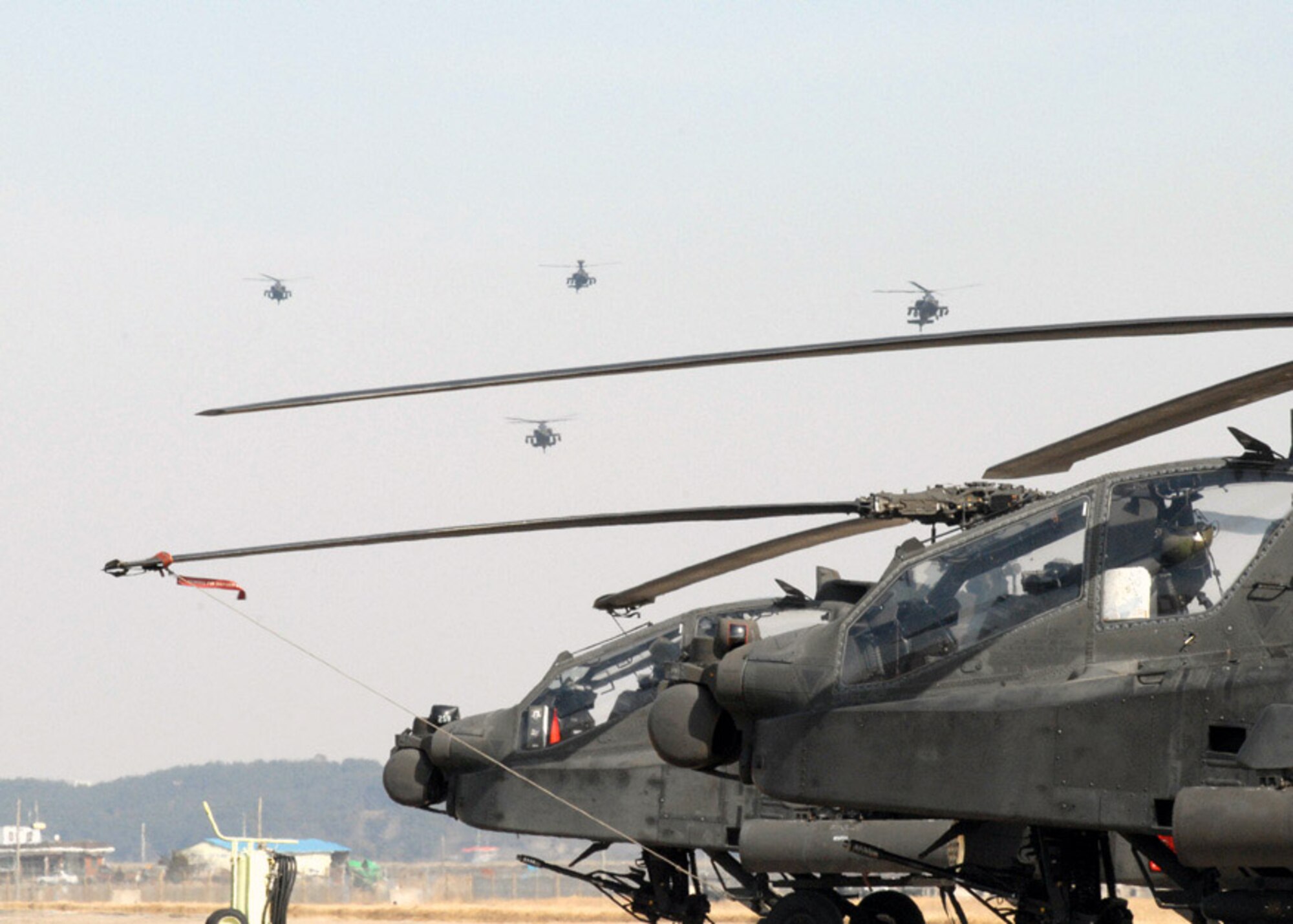 A second wave of AH-64 Apache helicopters arrive March 1 at Kunsan Air Base, South Korea. The Apache's arrived from Camp Humphrey's, Bravo Company 4-2, as part of the Key Resolve/Foal Eagle Exercise, enhancing combat readiness and joint interoperability. (U.S. Air Force Photo/Staff Sgt. Araceli Alarcon) 