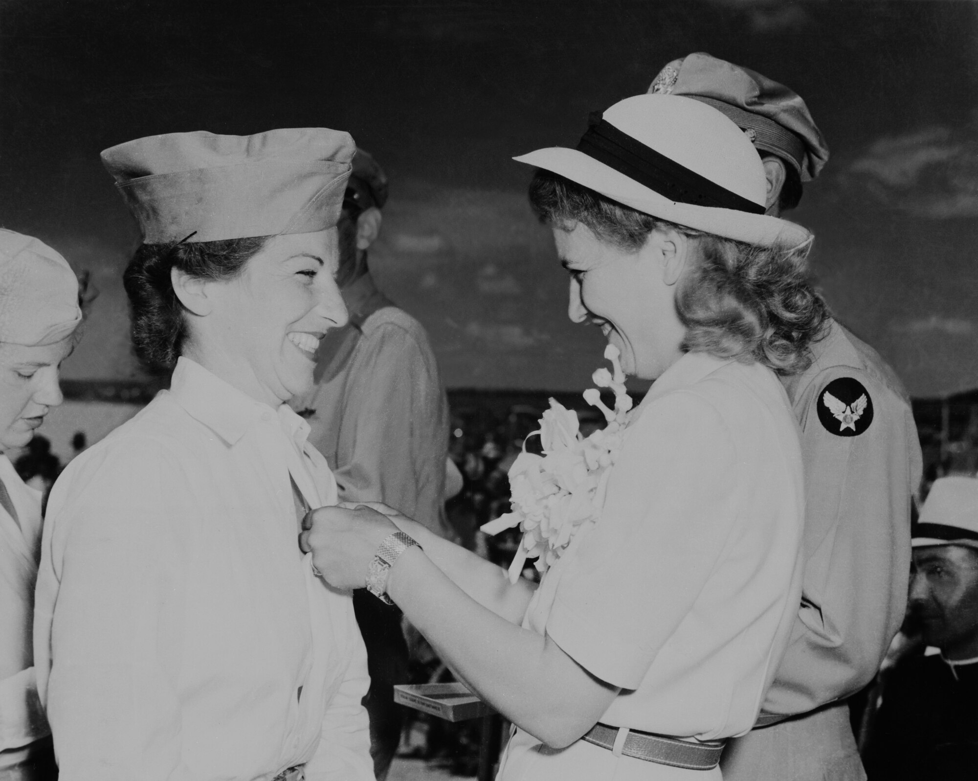 Jacqueline Cochran pins the wings on new WASP training graduate Isabel Fenton during graduation at Avenger Field, Sweetwater, Texas, on Jul 3, 1943. (Photo courtesy Air Armament Center History Office)
