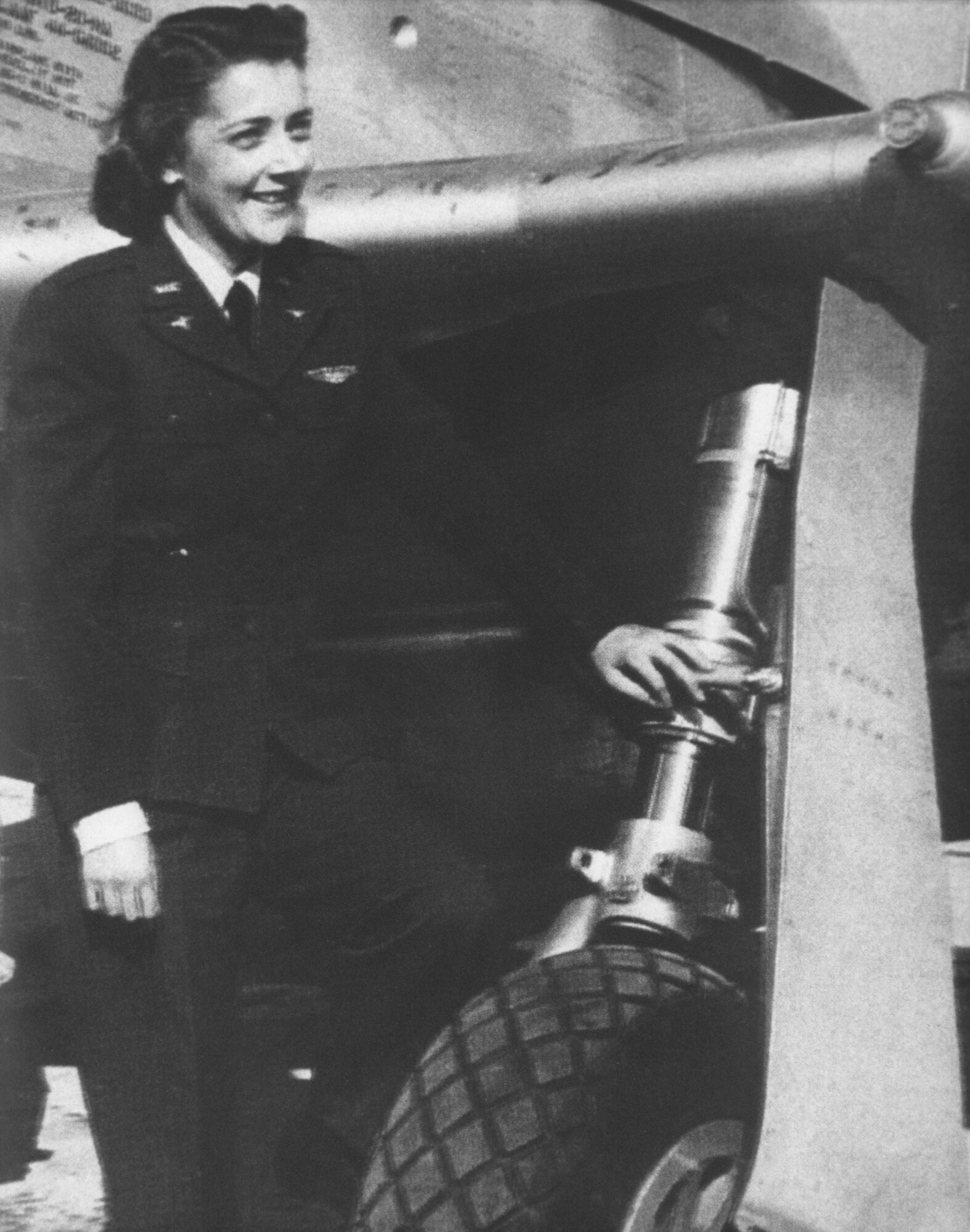 Helen Anne Turner in front of her ready-to-ferry P-51 Mustang in the approved WASP uniform. (Photo courtesy Air Armament Center History Office)