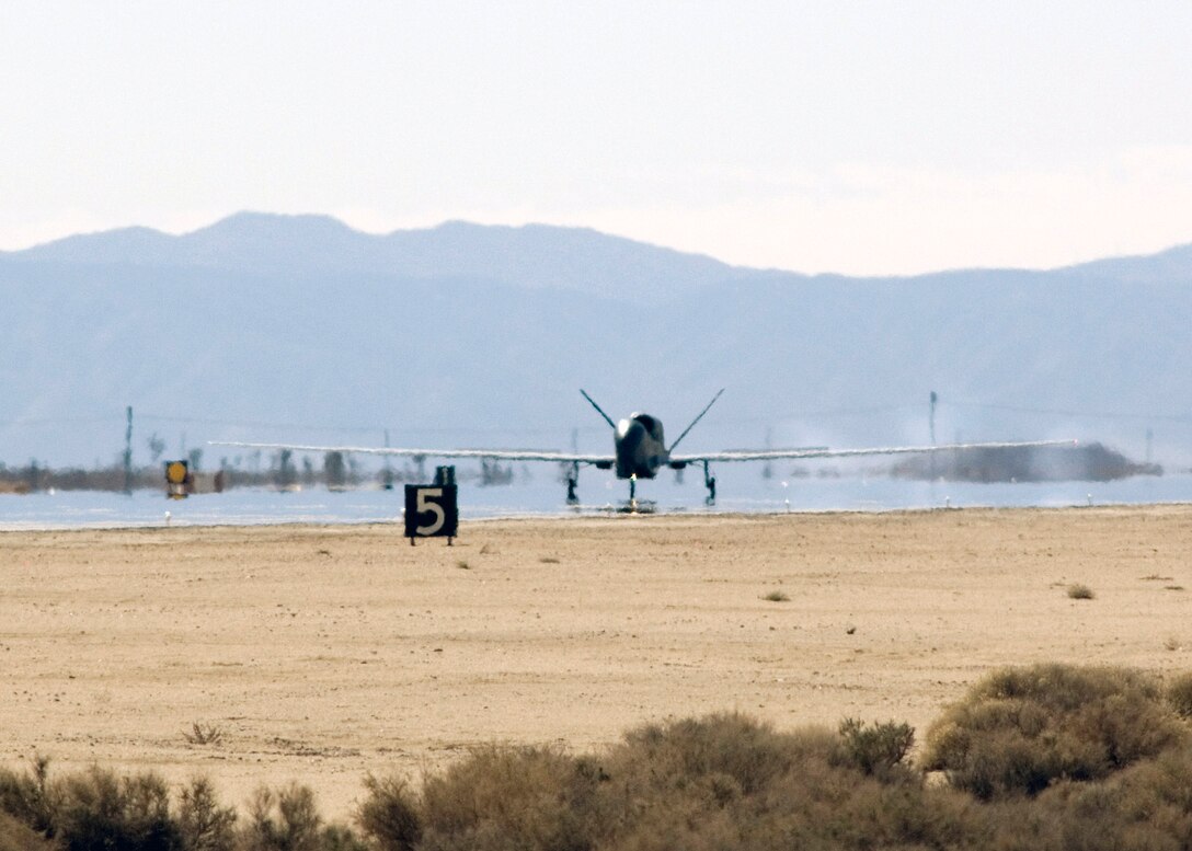 The Global Hawk unmanned aerial vehicle lands after an eight-hour mission Feb. 28 at Edwards Air Force Base, Calif. The flight marked the 10th anniversary of the Global Hawk's first flight at Edwards AFB, where the aircraft flew for one hour and reached an altitude of 32,000 feet. (U.S. Air Force photo/Jim Shryne) 