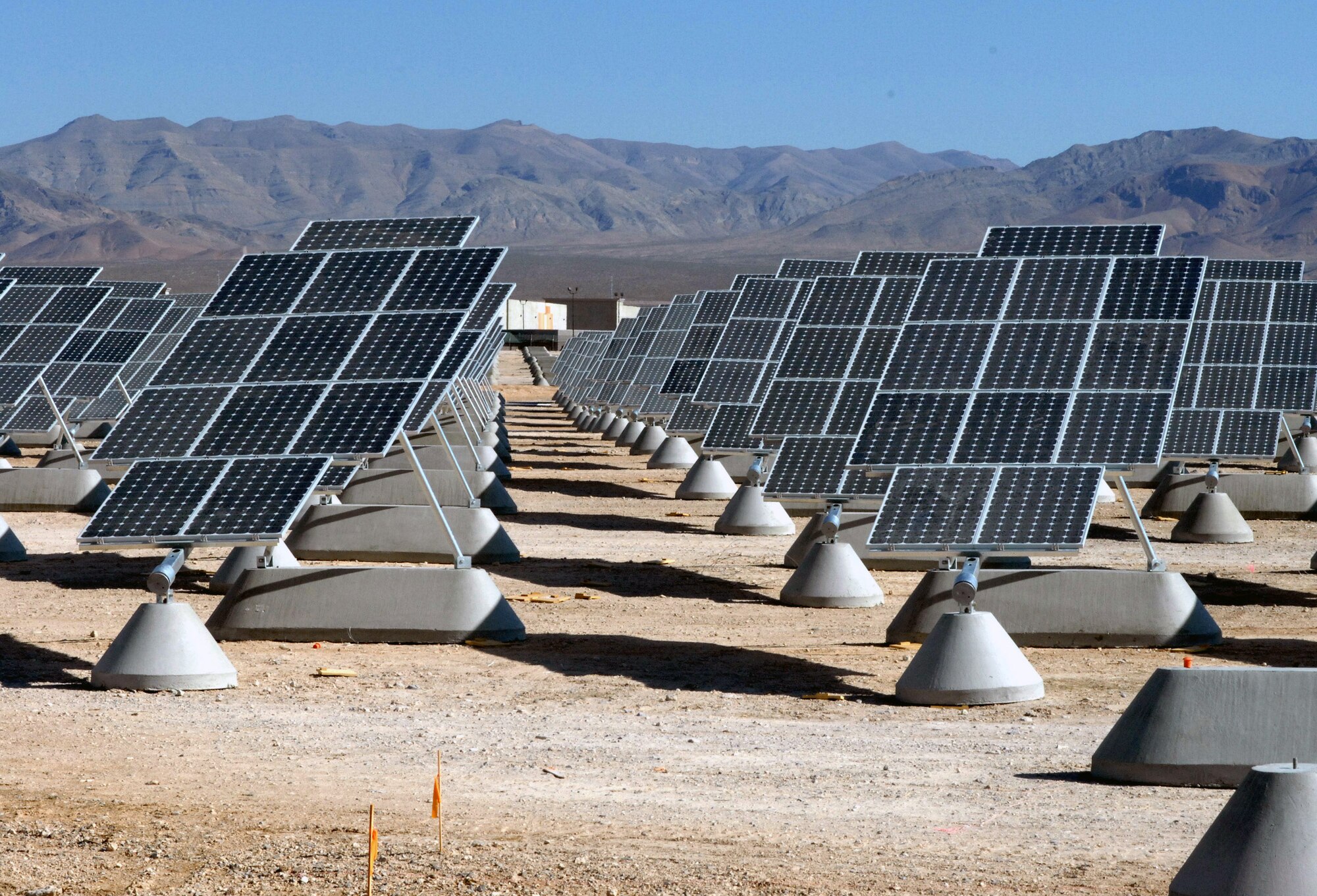 The largest photovoltaic solar power plant in the United States is becoming a reality at Nellis Air Force Base, Nev. The solar arrays can produce 15 megawatts of power for the Air Force. (U.S. Air Force photo/Paul Ridgway) 
