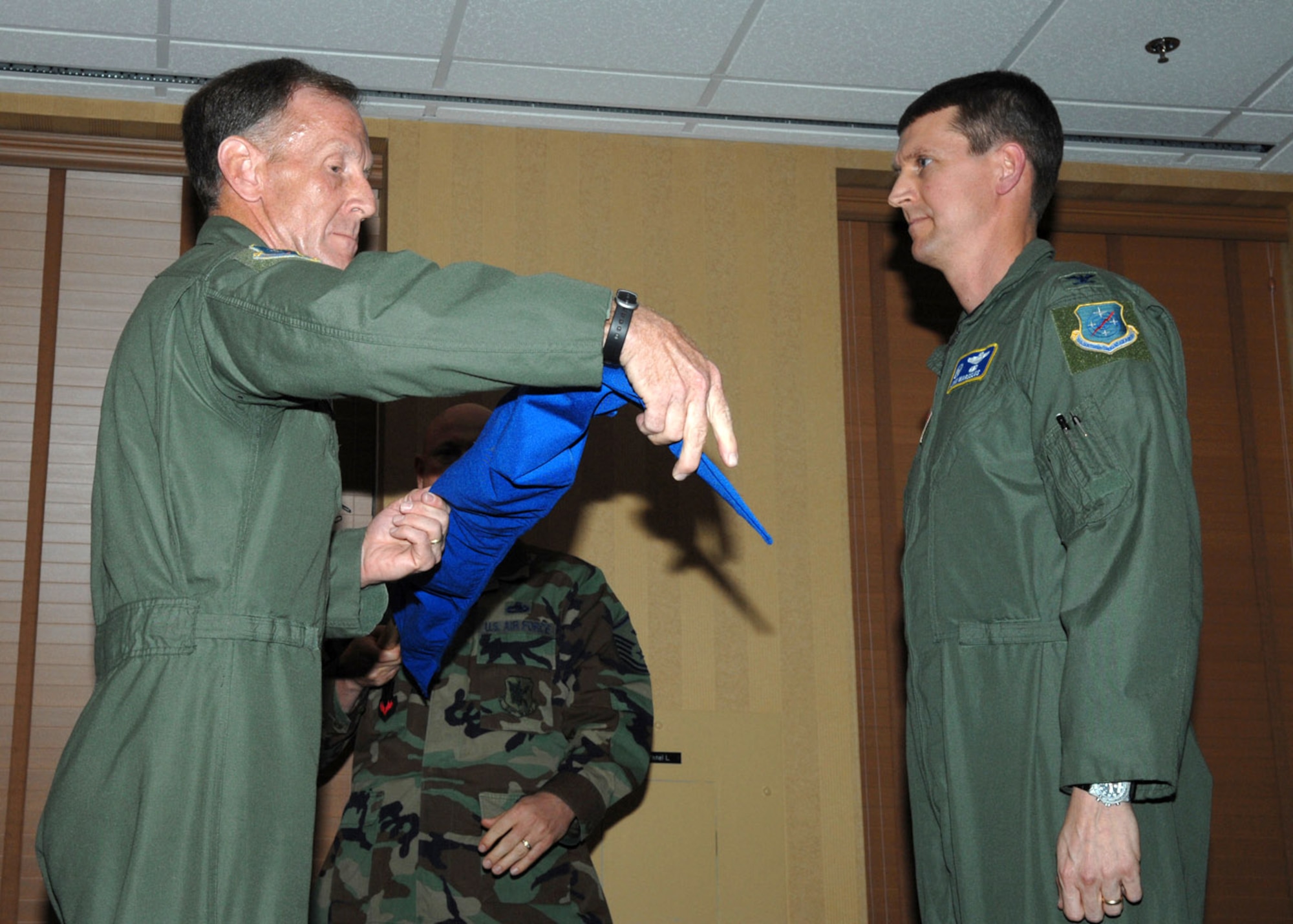 Lt. Gen. Norman R. Seip uncovers the 612th Air and Space Operations Center guidon with Col. John E. Marselus during the 12th Air Force and Air Forces Southern Redesignation Ceremony Feb. 29 at Davis-Monthan Air Force Base, Ariz. General Seip is the AFSOUTH commander, and Colonel Marselus is the 612th Air and Space Operations Center commander. (U.S. Air Force photo/Senior Airman Christina D. Kinsey)