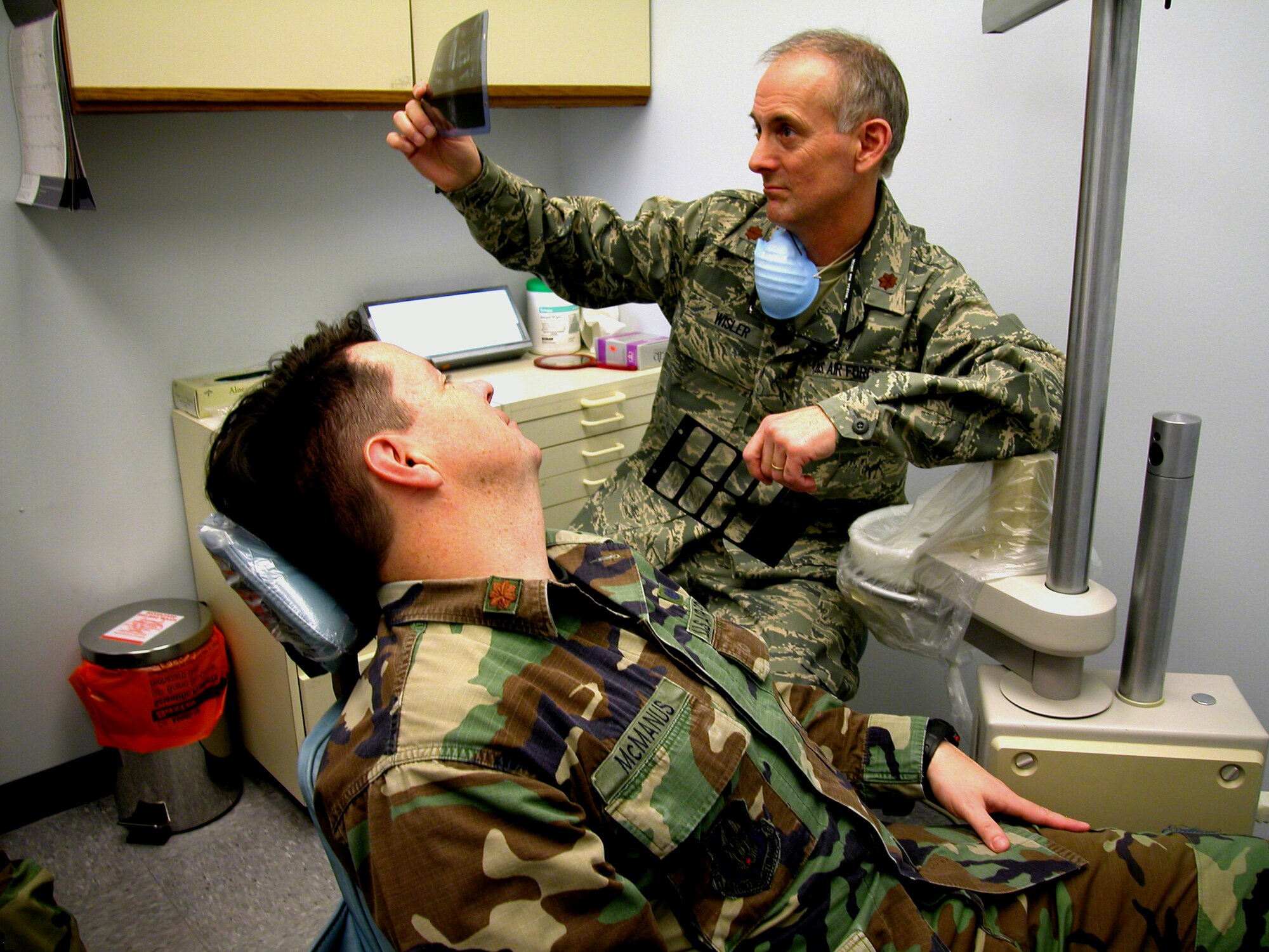 GRISSOM AIR RESERVE BASE, Ind., -- Maj. Craig Wisler, chief of dental services for Grissom's 434th Aerospace Medicine Squadron, reviews the dental X-rays of Maj. Stephen McManus, staff judge advocate, during his long physical.  A reservist's dental health is a critical component of mobility readiness. A full dental exam by a military doctor is required during the long physical at three year intervals. (U.S. Air Force photo/Senior Airman Chris Bolen)