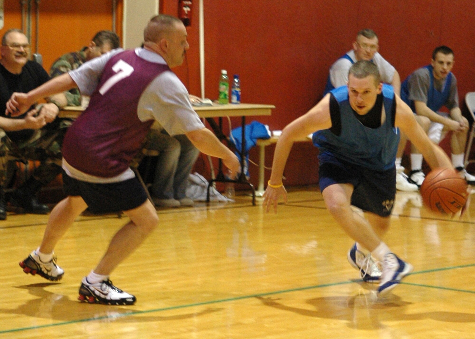 GRISSOM AIR RESERVE BASE, Ind., -- Cory Walters, a guard with the 434th Civil Engineer Squadron, lowers his head and drives toward the basket during final round play of the annual Grissom basketball tournament. This year's tournament was won by the DOD Police team. (U.S. Air Force photo/SrA. Ben Mota)