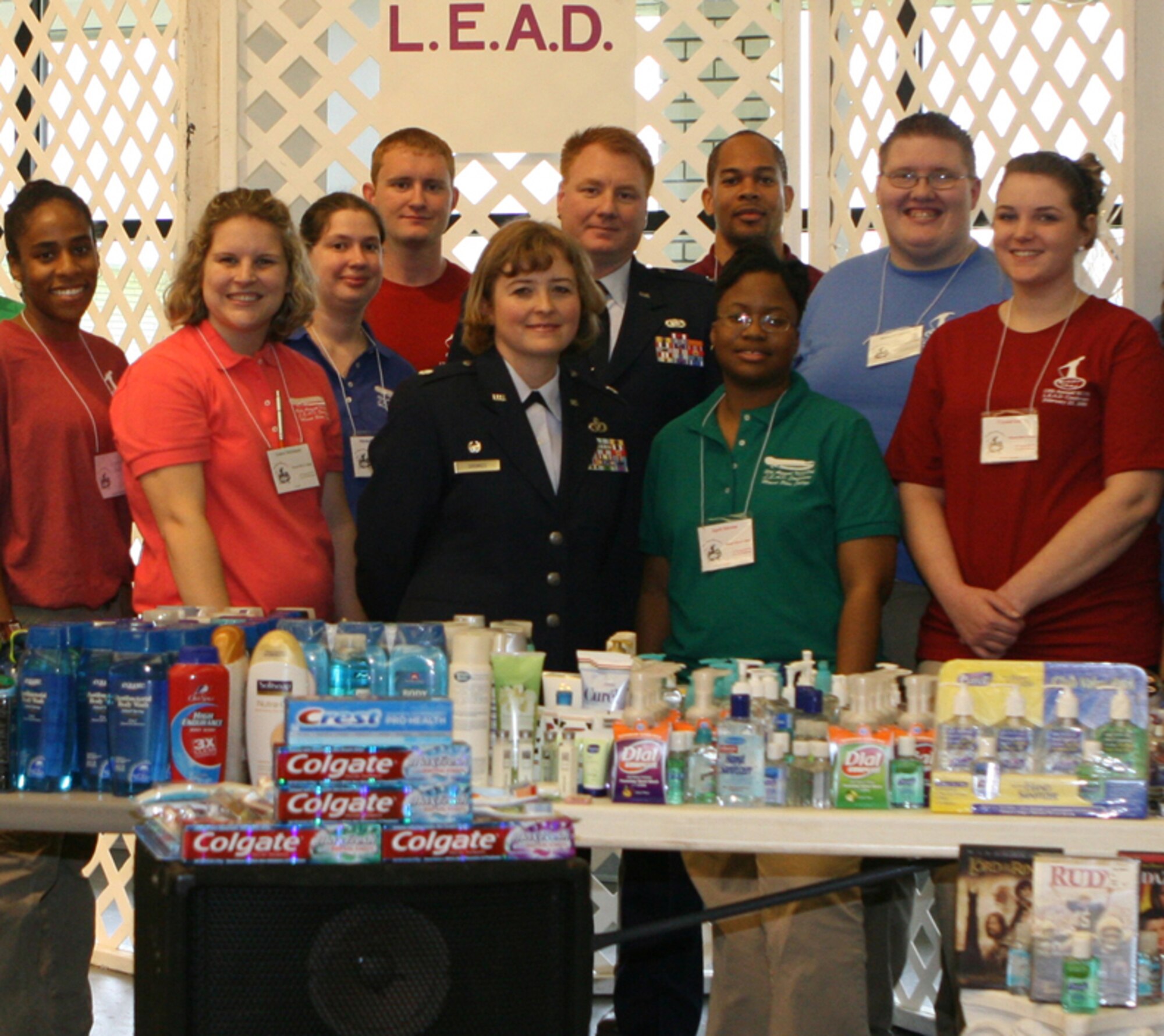 SEYMOUR JOHNSON AIR FORCE BASE, N.C. -- Members of Mount Olive College presented Lt. Col. Kerri Grimes (front), 916th Civil Engineer Squadron commander, with a variety of items collected to help support deployed Airmen and reservists serving overseas. Capt. Ted Janicki (back), a former member of the 916th Air Refueling Wing is also employed by Mount Olive and helped spearhead the campaign. The items were presented during the college's 12th Annual L.E.A.D conference on Feb. 23. The conference is attended by 250 college students from across the state and focuses on leadership topics. The conference organizers require that the host college support a community service project and Mount Olive chose the Airmen of Seymour Johnson Air Force Base. Lt. Col. Grimes currently has more 30 members of her Reserve squadron deployed to the Middle East.