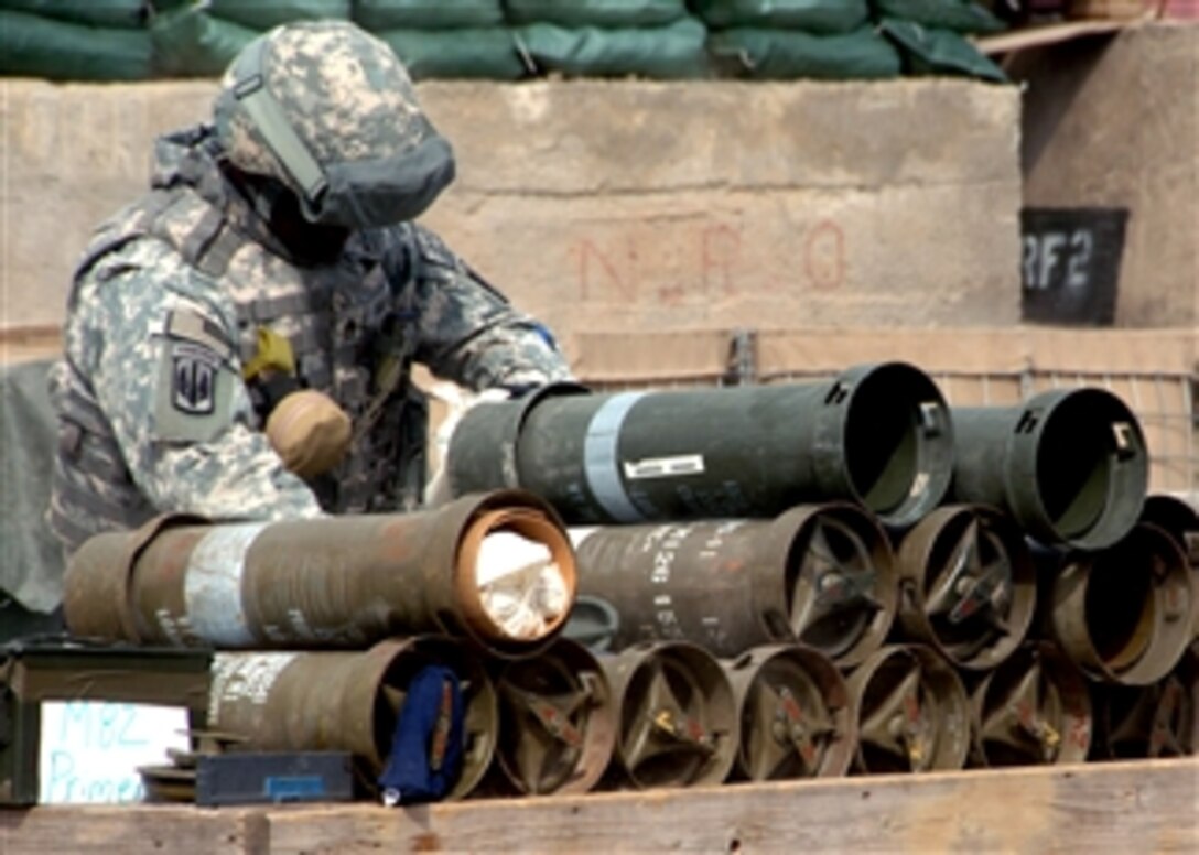 U.S. Army soldiers test fire an Excalibur artillery round on Forward Operating Base Salerno, Afghanistan, Feb. 28, 2008. The Excalibur round is a precision guided global positioning system. The soldiers are assigned to the 82nd Airborne Division's 4th Brigade Combat Team, 321st Field Artillery.