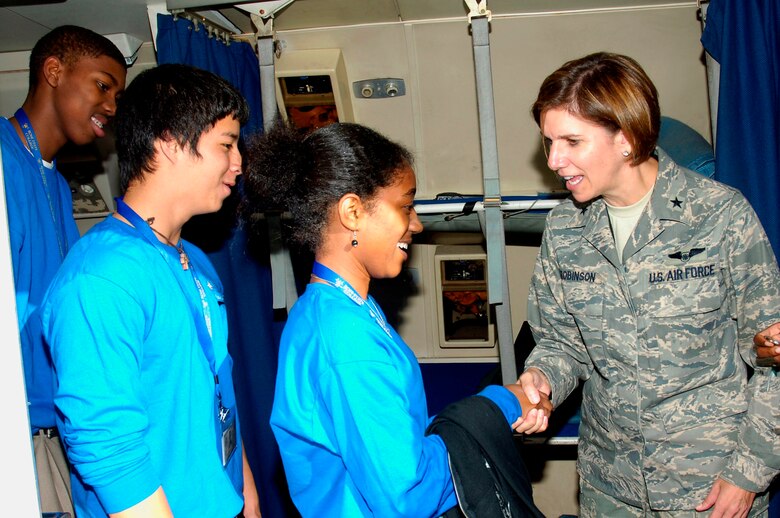 Brigadier General Lori J. Robinson, 552nd ACW Commander, coined each student individually as they exited the aircraft. Photo compliments of Visual Information.