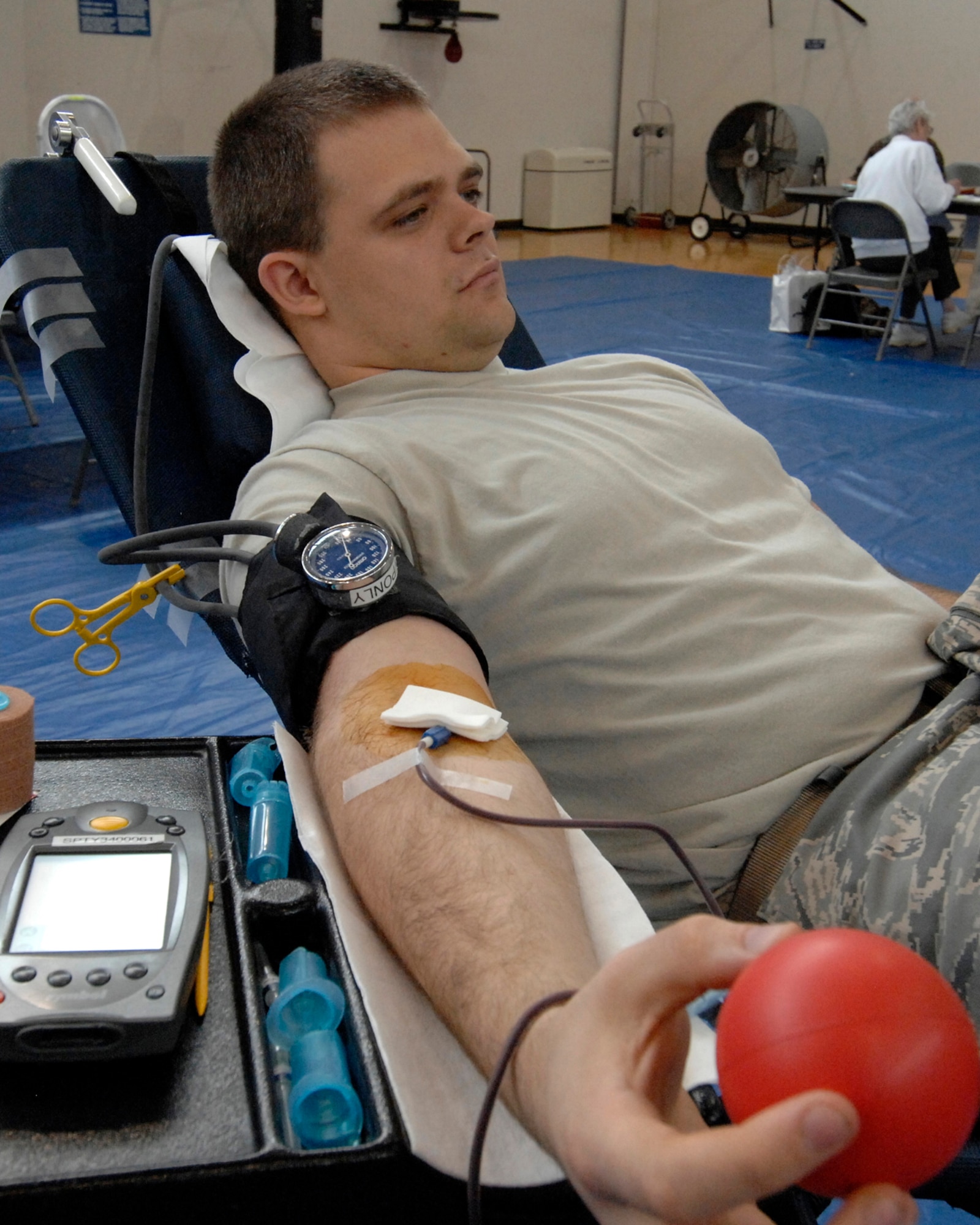 Airman Nathan Smith, 61st Medical Group, donates blood at the base blood drive, Feb. 20.  (Photo by Lou Hernandez)