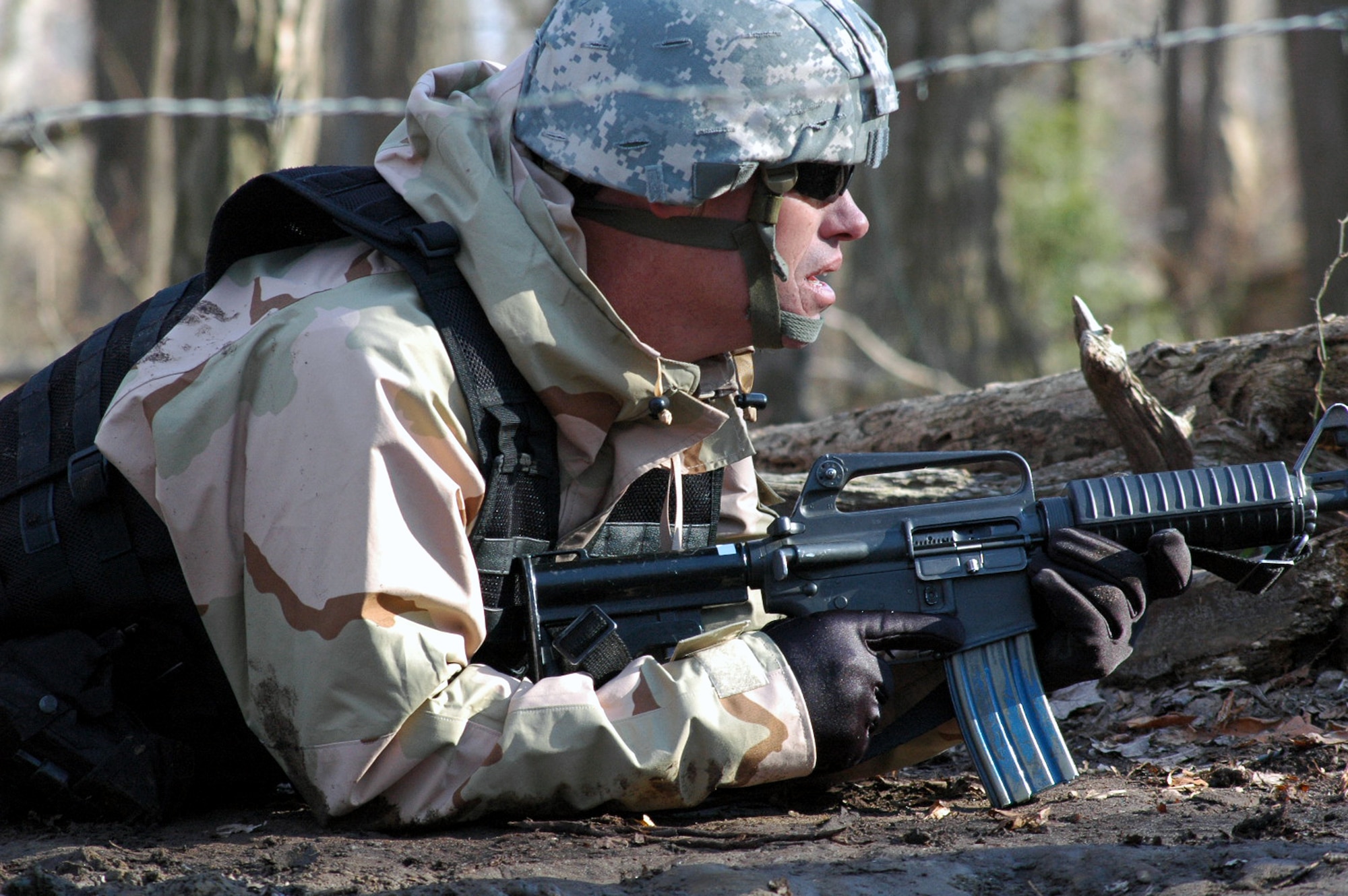 A student goes through the combat first aid obstacle course on a range on Fort Dix, N.J., Feb. 29, 2008, as part of training in the U.S. Air Force Expeditionary Center's Air Advisor Course 08-1.  The course, taught by the Center's Expeditionary Operations School, is the first of its kind for the Center and is preparing Airmen deploying to Afghanistan and Iraq who will in turn be training military forces in those countries. (U.S. Air Force Photo/Tech. Sgt. Scott T. Sturkol)