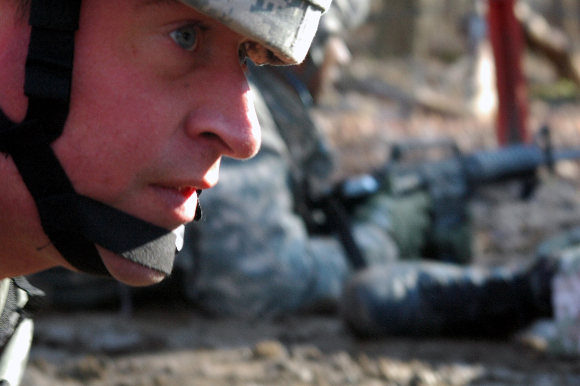 Tech. Sgt. Jason Bloom and other students go through the combat first aid obstacle course on a range on Fort Dix, N.J., Feb. 29, 2008, as part of training in the U.S. Air Force Expeditionary Center's Air Advisor Course 08-1.  The course, taught by the Center's Expeditionary Operations School, is the first of its kind for the Center and is preparing Airmen deploying to Afghanistan and Iraq who will in turn be training military forces in those countries.  Sergeant Bloom is from Hurlburt Field, Fla.  (U.S. Air Force Photo/Tech. Sgt. Scott T. Sturkol)