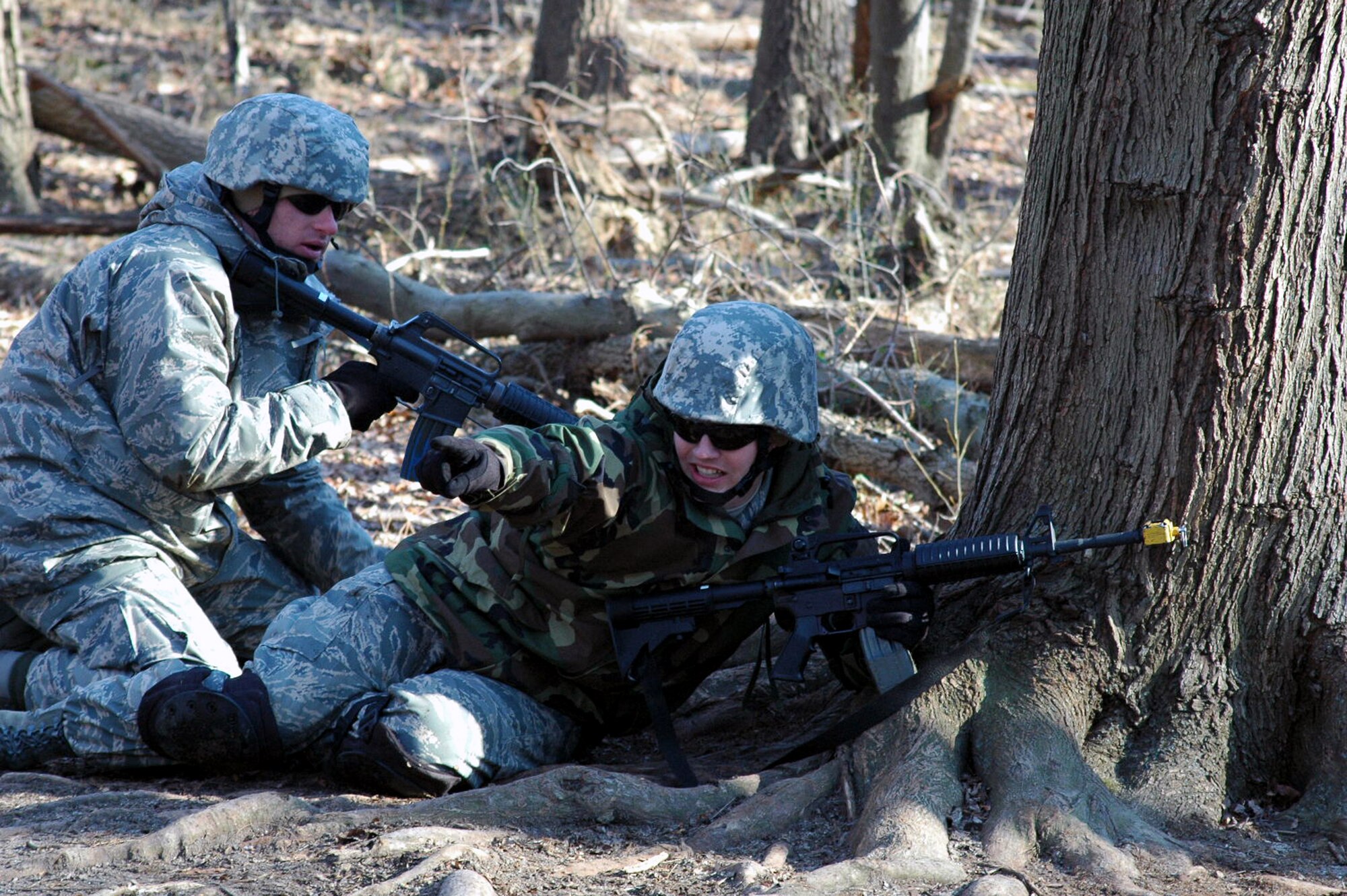 Students go through the combat first aid obstacle course on a range on Fort Dix, N.J., Feb. 29, 2008, as part of training in the U.S. Air Force Expeditionary Center's Air Advisor Course 08-1.  The course, taught by the Center's Expeditionary Operations School, is the first of its kind for the Center and is preparing Airmen deploying to Afghanistan and Iraq who will in turn be training military forces in those countries.  (U.S. Air Force Photo/Tech. Sgt. Scott T. Sturkol)
