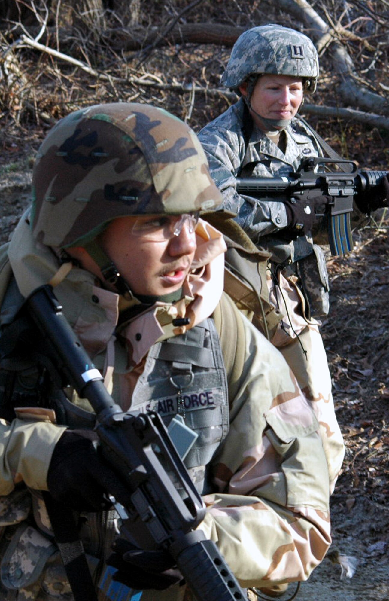 Students go through the combat first aid obstacle course on a range on Fort Dix, N.J., Feb. 29, 2008, as part of training in the U.S. Air Force Expeditionary Center's Air Advisor Course 08-1.  The course, taught by the Center's Expeditionary Operations School, is the first of its kind for the Center and is preparing Airmen deploying to Afghanistan and Iraq who will in turn be training military forces in those countries.  (U.S. Air Force Photo/Tech. Sgt. Scott T. Sturkol)