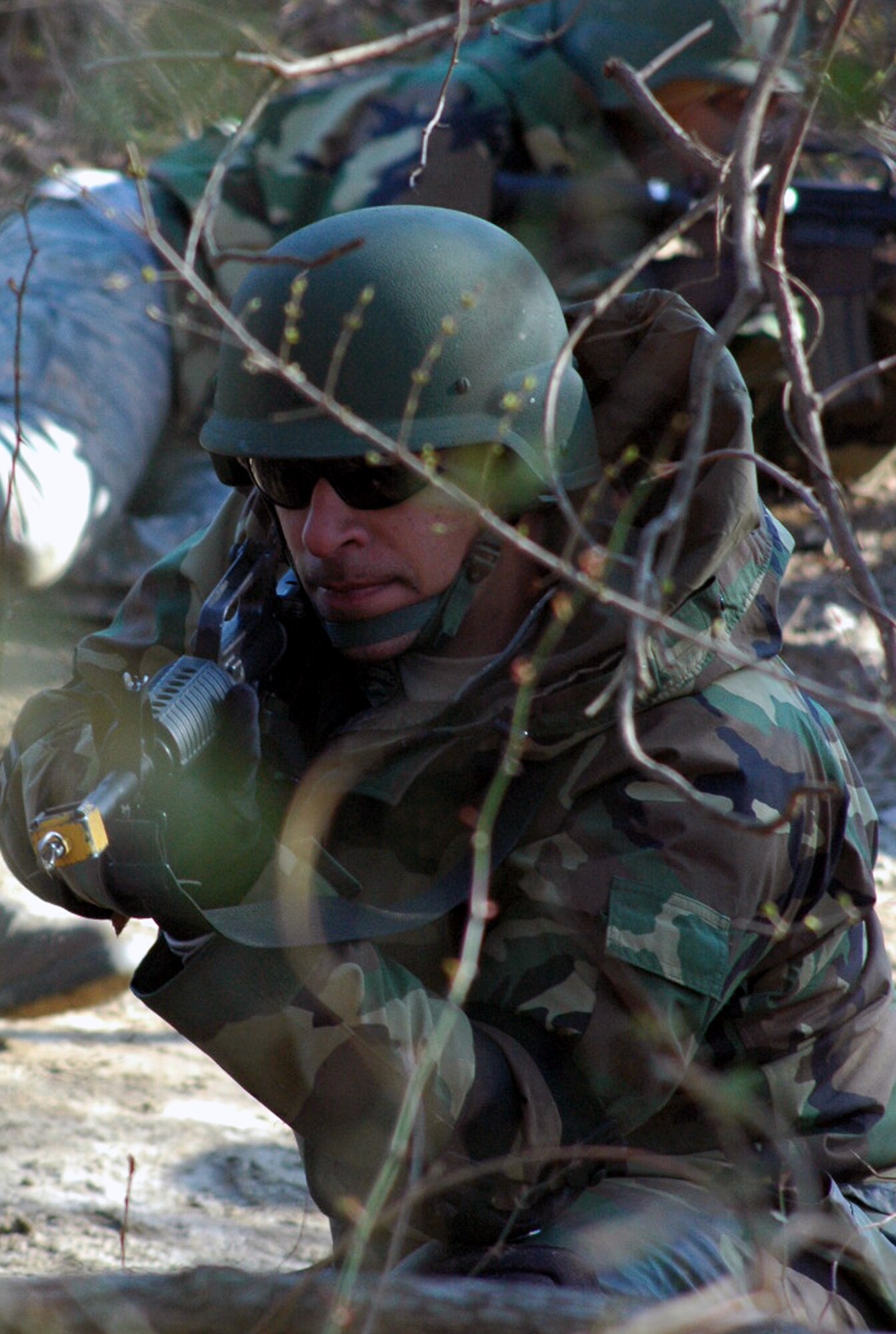 Staff Sgt. Saul Bookman and other students go through the combat first aid obstacle course on a range on Fort Dix, N.J., Feb. 29, 2008, as part of training in the U.S. Air Force Expeditionary Center's Air Advisor Course 08-1.  The course, taught by the Center's Expeditionary Operations School, is the first of its kind for the Center and is preparing Airmen deploying to Afghanistan and Iraq who will in turn be training military forces in those countries.  Sergeant Bookman is from Lackland Air Force Base, Texas.  (U.S. Air Force Photo/Tech. Sgt. Scott T. Sturkol)