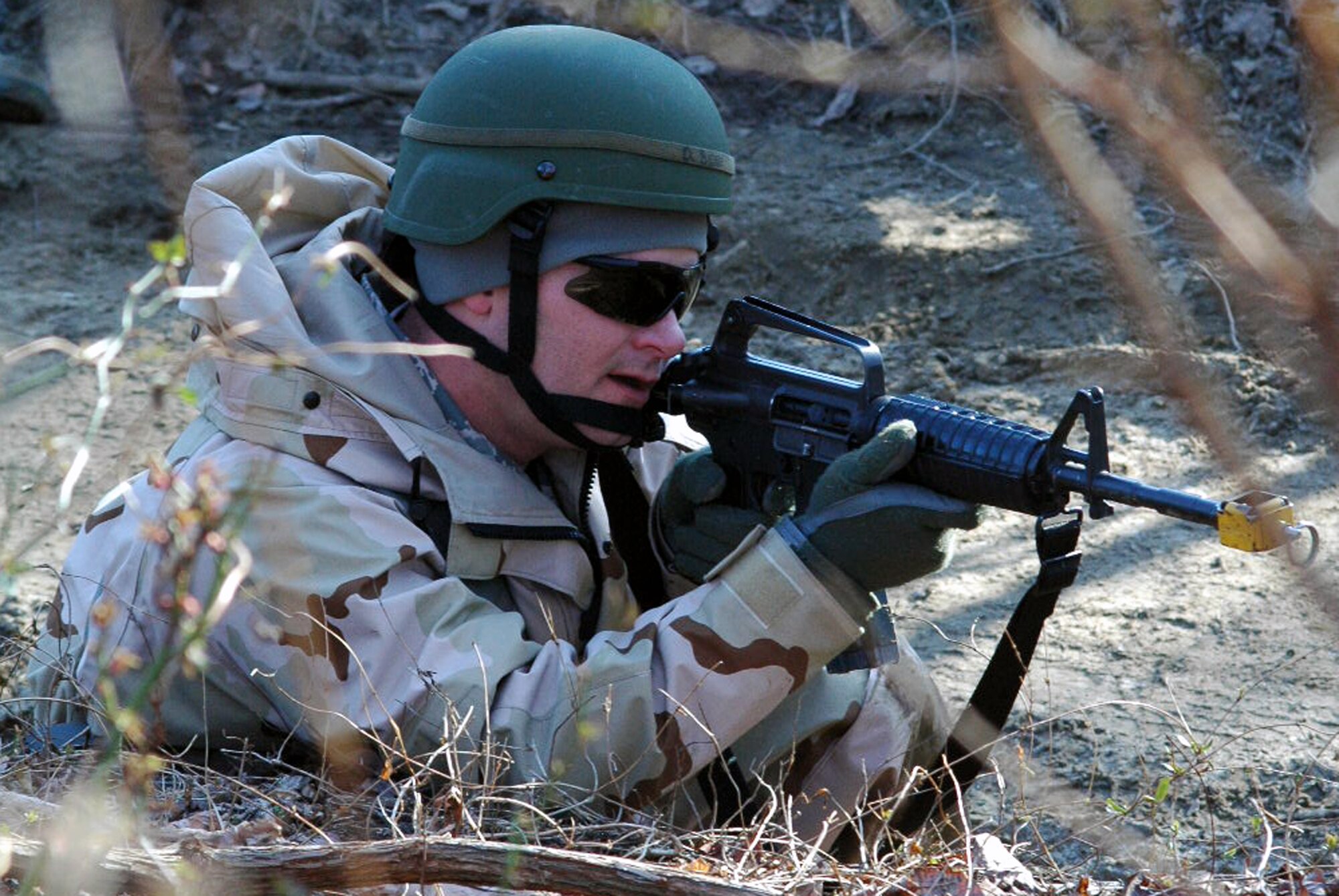 Master Sgt. Daniel Blow and other students go through the combat first aid obstacle course on a range on Fort Dix, N.J., Feb. 29, 2008, as part of training in the U.S. Air Force Expeditionary Center's Air Advisor Course 08-1.  The course, taught by the Center's Expeditionary Operations School, is the first of its kind for the Center and is preparing Airmen deploying to Afghanistan and Iraq who will in turn be training military forces in those countries.  Sergeant Blow is from Minot Air Force Base, N.D.  (U.S. Air Force Photo/Tech. Sgt. Scott T. Sturkol)
