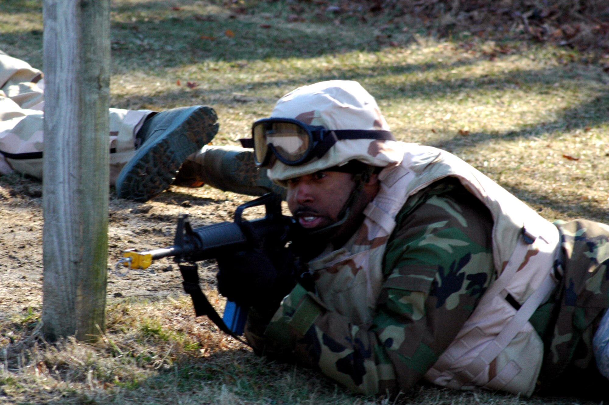Tech. Sgt. Darnell Gordon and other students go through the combat first aid obstacle course on a range on Fort Dix, N.J., Feb. 29, 2008, as part of training in the U.S. Air Force Expeditionary Center's Air Advisor Course 08-1.  The course, taught by the Center's Expeditionary Operations School, is the first of its kind for the Center and is preparing Airmen deploying to Afghanistan and Iraq who will in turn be training military forces in those countries.  Sergeant Gordon is from the 552nd Operations Support Squadron, Tinker Air Force Base, Okla.  (U.S. Air Force Photo/Tech. Sgt. Scott T. Sturkol)