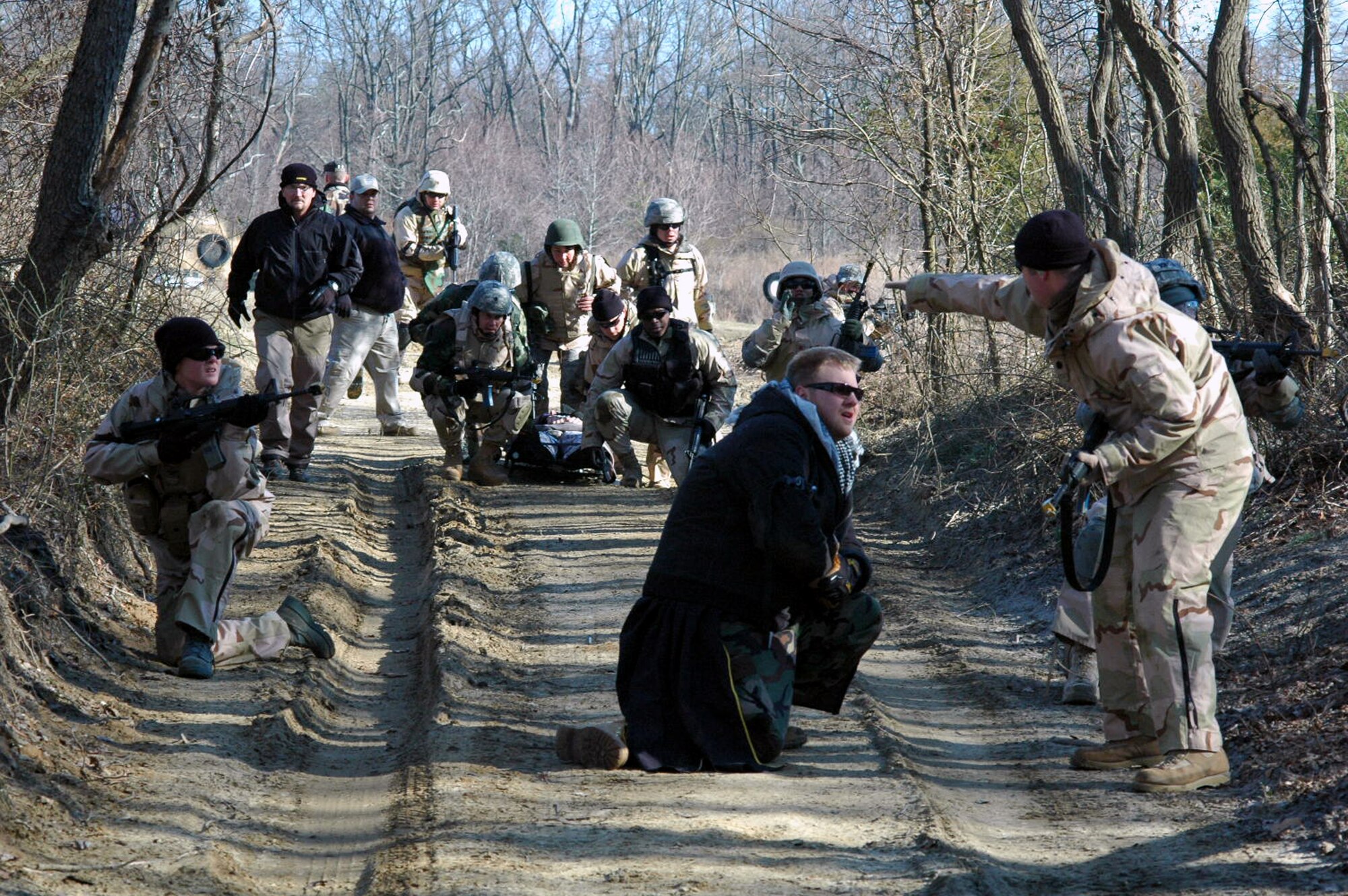 Students go through the combat first aid obstacle course on a range on Fort Dix, N.J., Feb. 29, 2008, as part of training in the U.S. Air Force Expeditionary Center's Air Advisor Course 08-1.  The course, taught by the Center's Expeditionary Operations School, is the first of its kind for the Center and is preparing Airmen deploying to Afghanistan and Iraq who will in turn be training military forces in those countries.  (U.S. Air Force Photo/Tech. Sgt. Scott T. Sturkol)