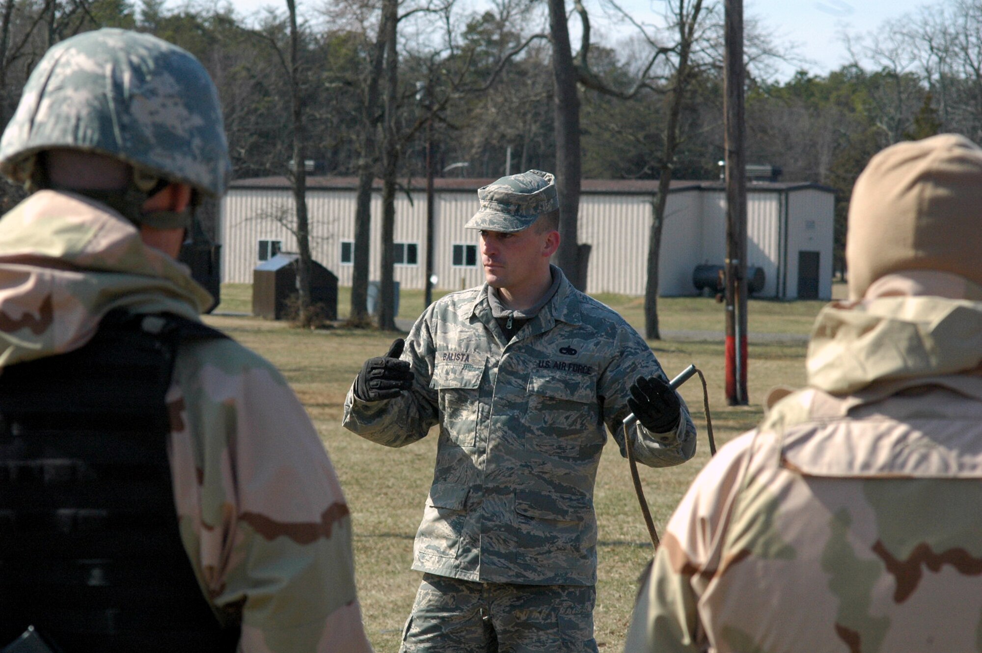 Tech. Sgt. David Balista, 421st Combat Training instructor, describes the basic medical litter or stretcher used to transport patients in a battlefield during combat first aid training for students in the U.S. Air Force Expeditionary Center's Air Advisor Course 08-1 Feb. 29, 2008, on a range on Fort Dix, N.J.  The course is taught by the Center's Expeditionary Operations School and combat first aid was one of the main subjects taught for the students who will be deploying to Iraq and Afghanistan.  (U.S. Air Force Photo/Tech. Sgt. Scott T. Sturkol)