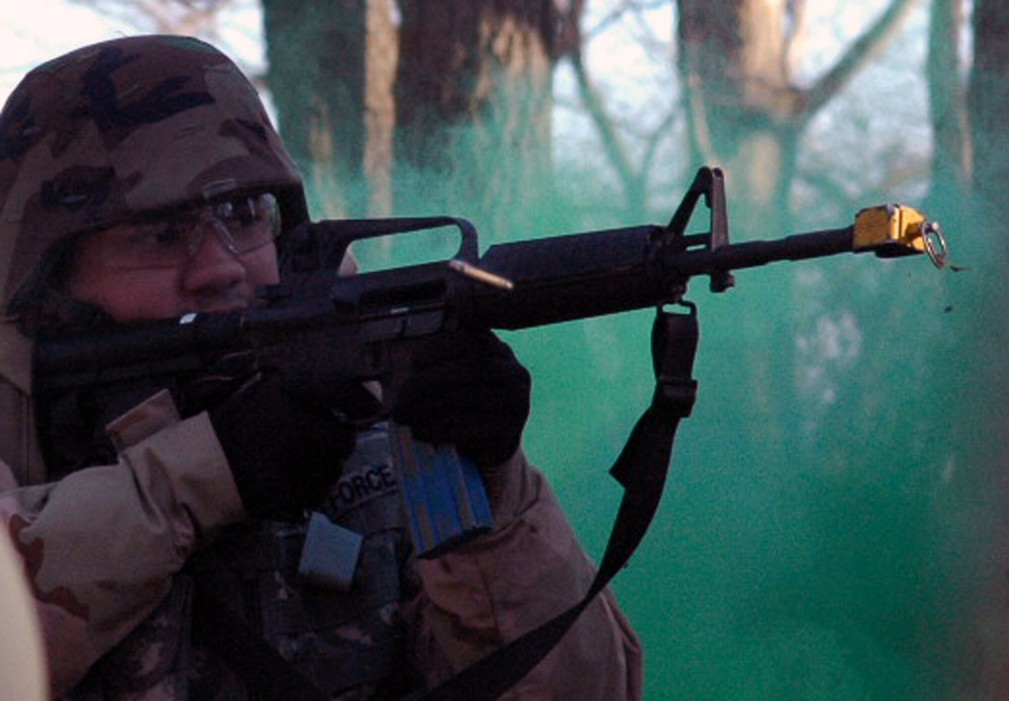 A student in the U.S. Air Force Expeditionary Center's Air Advisor Course 08-1 responds to "enemy fire" as part of training in the combat first aid obstacle course during training on a range on Fort Dix, N.J., Feb. 29, 2008.  The course, taught by the Center's Expeditionary Operations School, is the first of its kind at the Center and is preparing Airmen for deployments to Afghanistan and Iraq where they will be training host nation military forces.  (U.S. Air Force Photo/Tech. Sgt. Scott T. Sturkol)