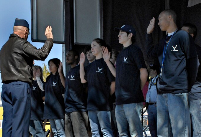 LAS VEGAS--General Victor E. Renuart Jr., North American Aerospace Defense Command and U.S. Northern Command commander, administers the oath of enlistment to delayed entry program members at the Las Vegas Motor Speedway here March 2. The U.S Air Force also participated in the event with a flyover by the U.S. Air Force Air Demonstration Squadron, the Thunderbirds, and the posting of colors by the Nellis AFB Honor Guard. (U.S Air Force photo/Airman Stephanie Rubi)