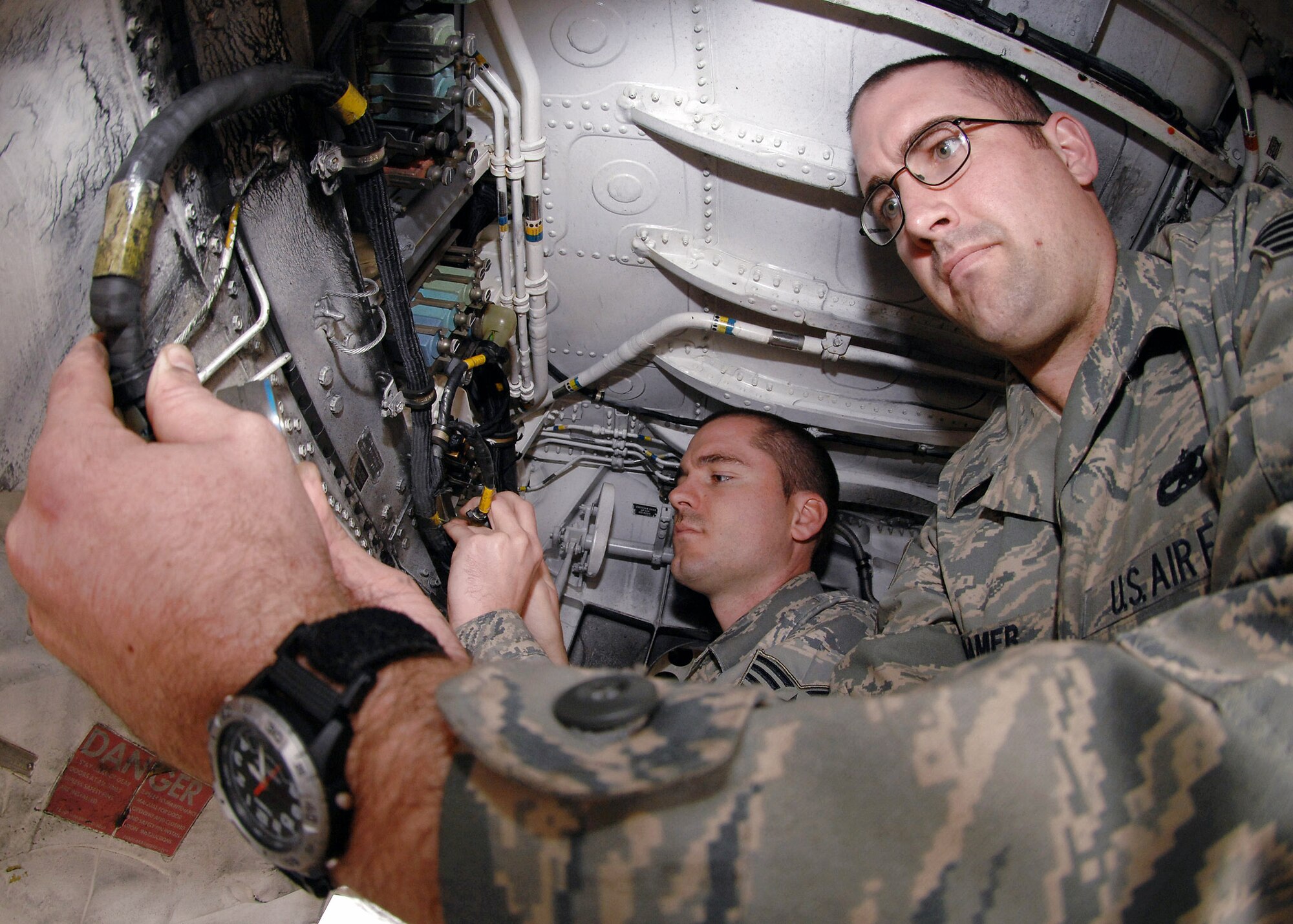Staff Sgts. Robert Townson (left) and Jason Cramer work on the right side electrical distribution harness on an F-15E Strike Eagle March 4 at Bagram Air Base, Afghanistan. Both sergeants are electro-environmental specialists with the 455th Expeditionary Aircraft Maintenance Squadron and are deployed from the 335th Aircraft Maintenance Squadron at Seymour Johnson Air Force Base, N.C. (U.S. Air Force photo/Master Sgt. Demetrius Lester) 