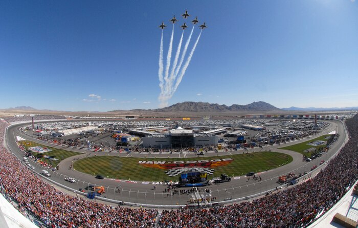 LAS VEGAS--The U.S. Air Force Air Demonstration Squadron, the Thunderbirds, soars over a sold-out Las Vegas Motor Speedway here March 2 before the NASCAR UAW-Dodge 400 Sprint Cup Series race. For more than a decade, the Nellis AFB community and Las Vegas Motor Speedway family have enjoyed a cooperative relationship that both thrills race fans and emblazons the patriotic spirit of America. (U.S. Air Force photo by Chief Master Sgt. Gary Emery)