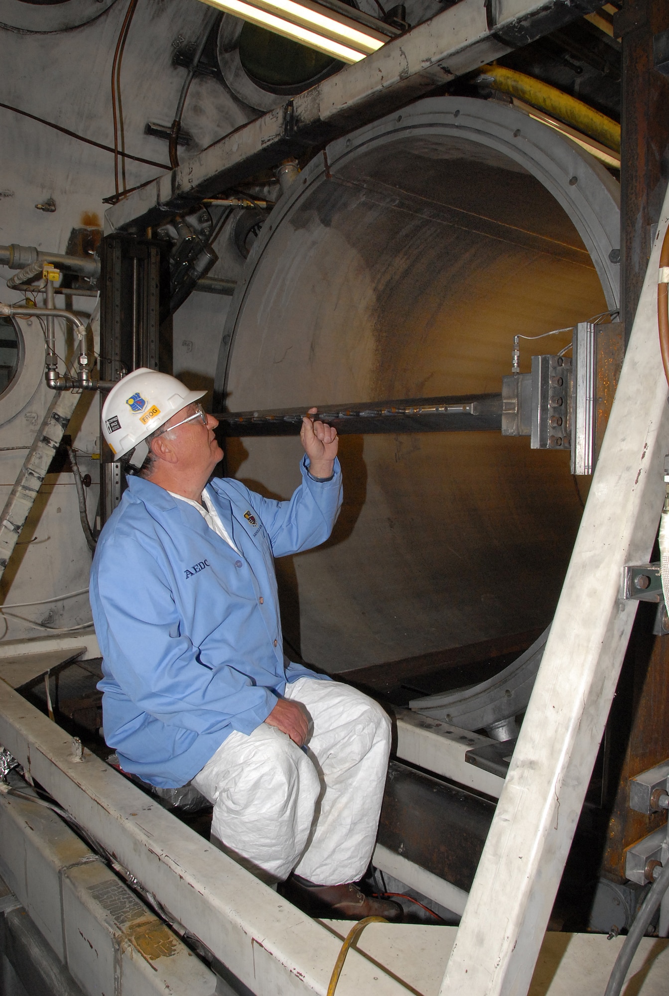 Aerospace Testing Alliance Outside Machinist Jeffrey Fulmer conducts a test probe inspection at the Arnold Engineering  Development Center (AEDC) Aerodynamic and Propulsion Test Unit (APTU) facility. The inspection is part of an ongoing major capability upgrade to APTU. The ongoing project includes a new combustion air heater (CAH) at APTU. The CAH, which underwent a successful preliminary burn using butane, is a crucial part of the upgrade, officially called the Hypersonic Air-Breathing Propulsion Test and Evaluation Capability (HAPTEC). This upgrade will provide AEDC with a high fidelity flight simulation capability in support of emerging missile-class hypersonic weapon systems and vehicles. (Photo by David Housch)