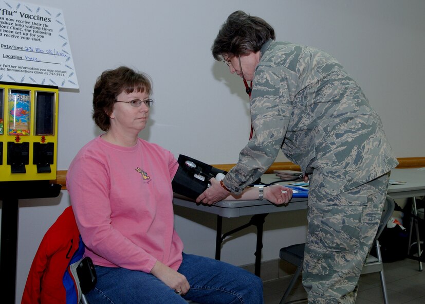 Col. Diane Hull, 319th Air Refueling Wing commander, gets her blood pressure checked  during the annual health fair at the Base Exchange February 22. The health fair was set up by the Medical Group and allows people to get more information on the different clinics by talking to representatives. (U.S. Air Force photo by Senior Airman Tiffany Colburn) 
